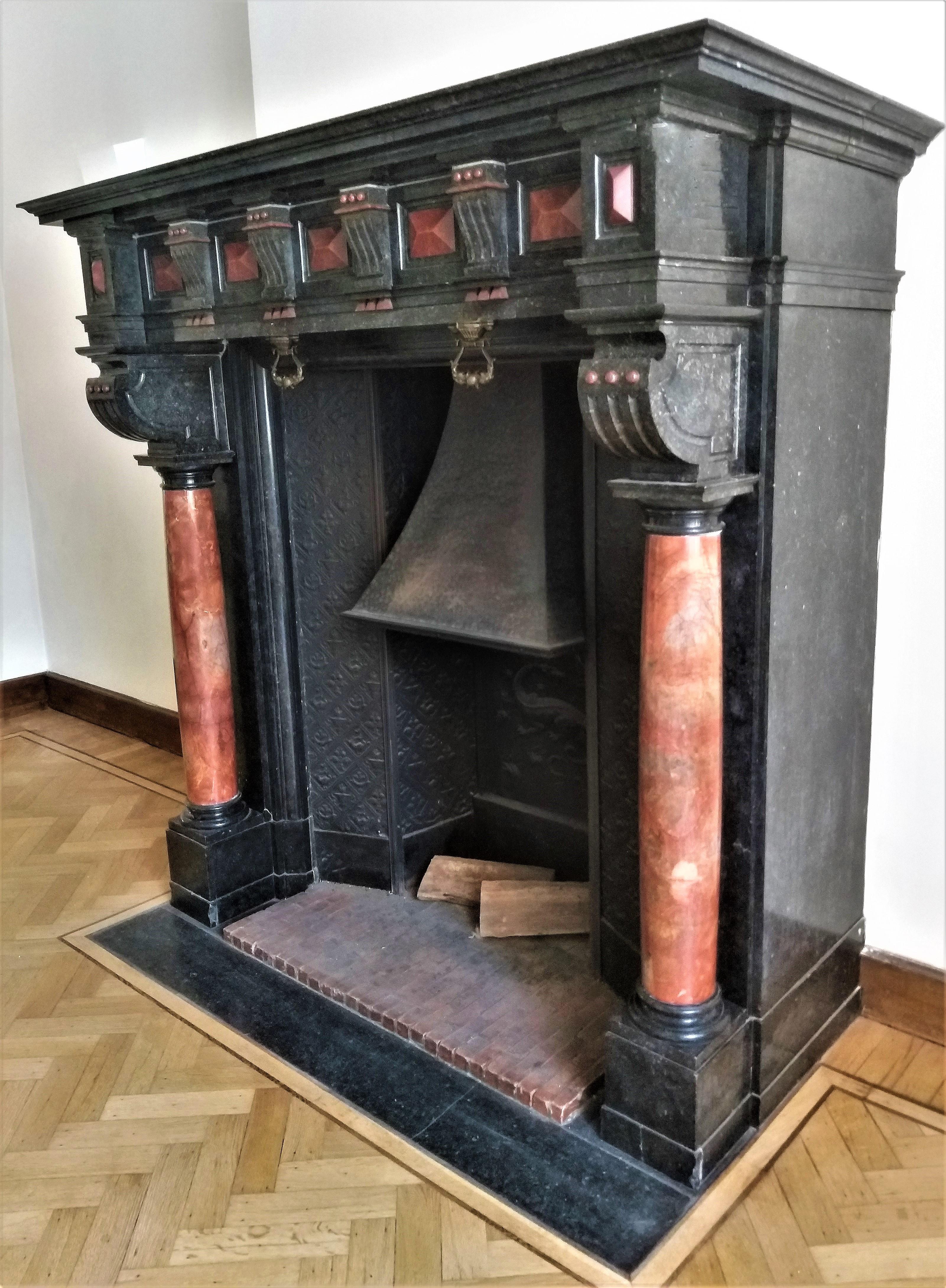 An impressive, Belgian fireplace surround from the late nineteenth century in the high Renaissance style. The heavy and moulded shelf rest above a rich decorated frieze. Full round and free standing columns resting on sturdy footblocks.  All made