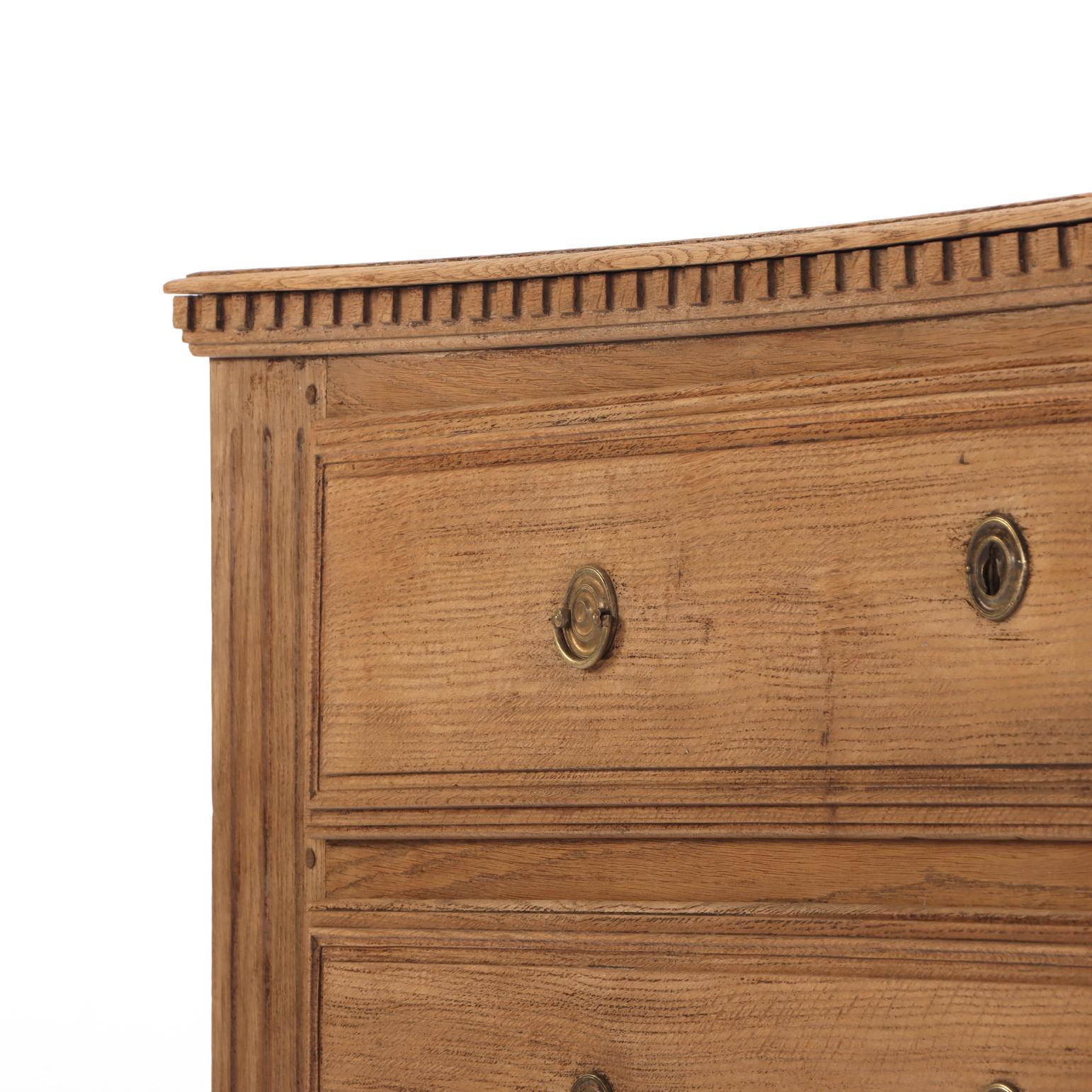 A Belgian Neoclassical style Three-Drawer Oak Commode, C. 1860. In Fair Condition For Sale In Philadelphia, PA
