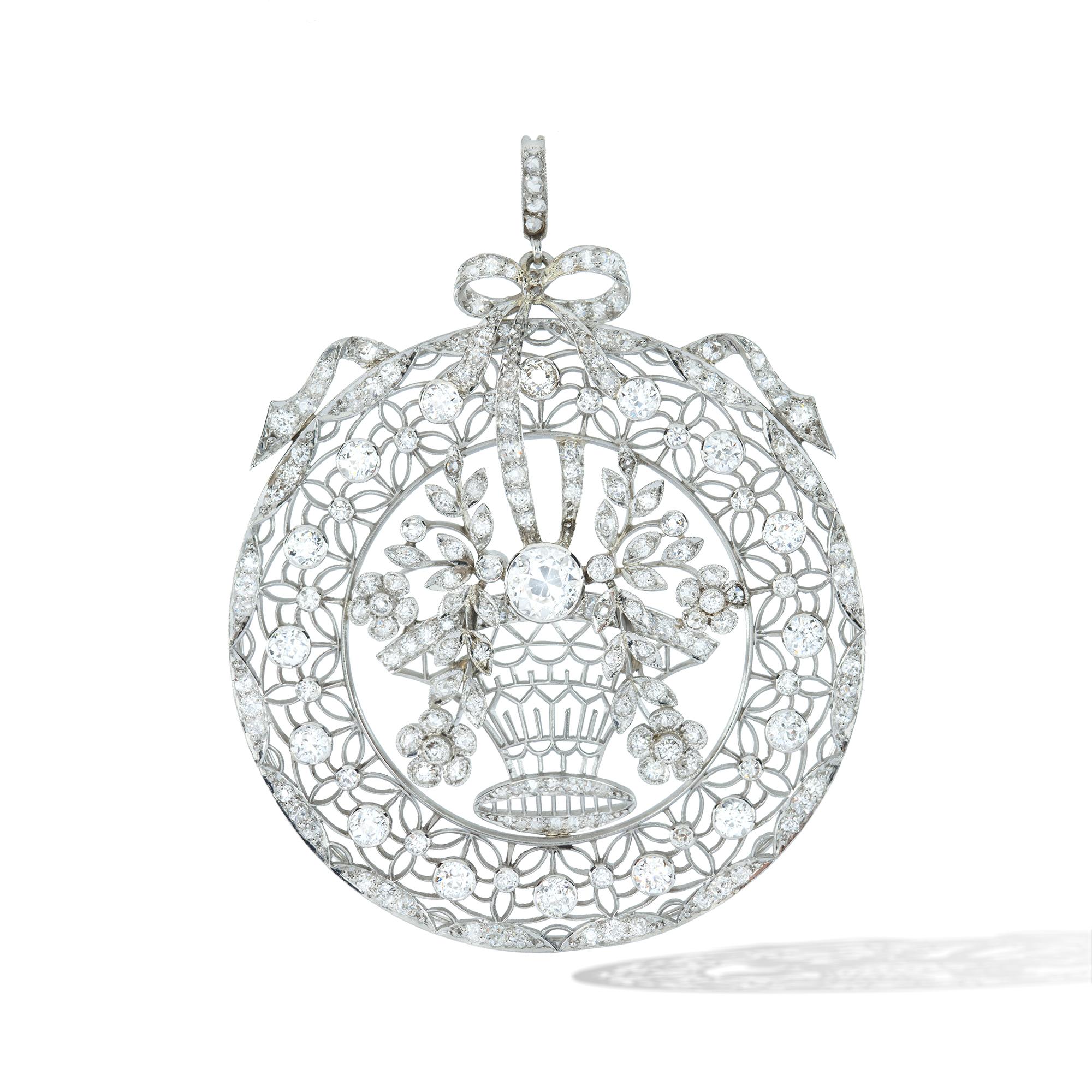 A Belle Epoque French diamond and pearl necklace, the circular open work giardinetto pendant centrally-set with a diamond-set basket with two diamond-set floral designed garlands surrounded by a diamond-set floral motif frame, all suspended by a