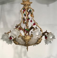 A Belle Epoque Eight Arm Chandelier Modelled with Dionysis/Bacchus Masks