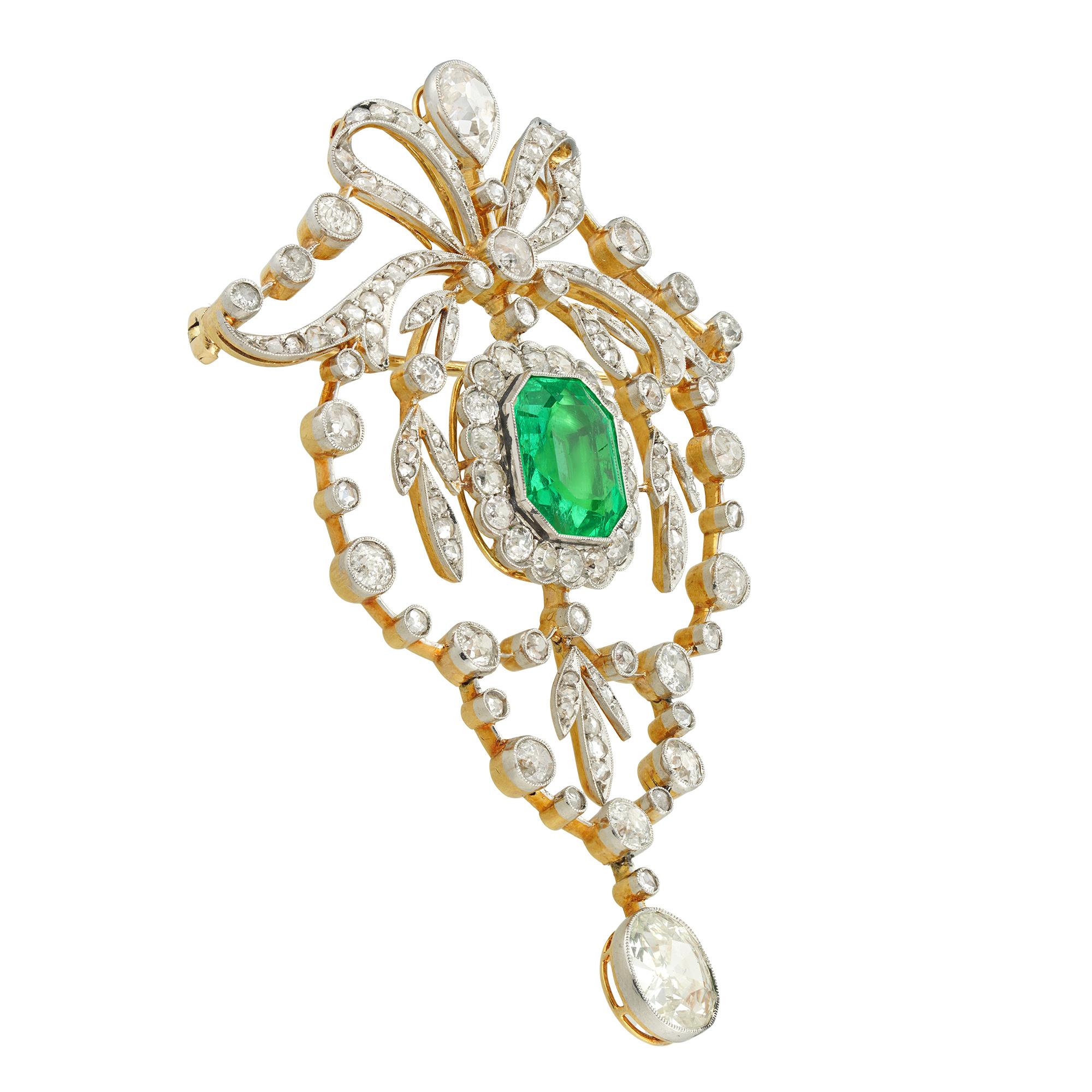 A Belle Époque emerald and diamond brooch, the step-cut emerald measuring approximately 5¾ carats accompanied by gemmological report stating to be of Colombian origin with minor clarity enhancement, surrounded by an octagonal frame set with small