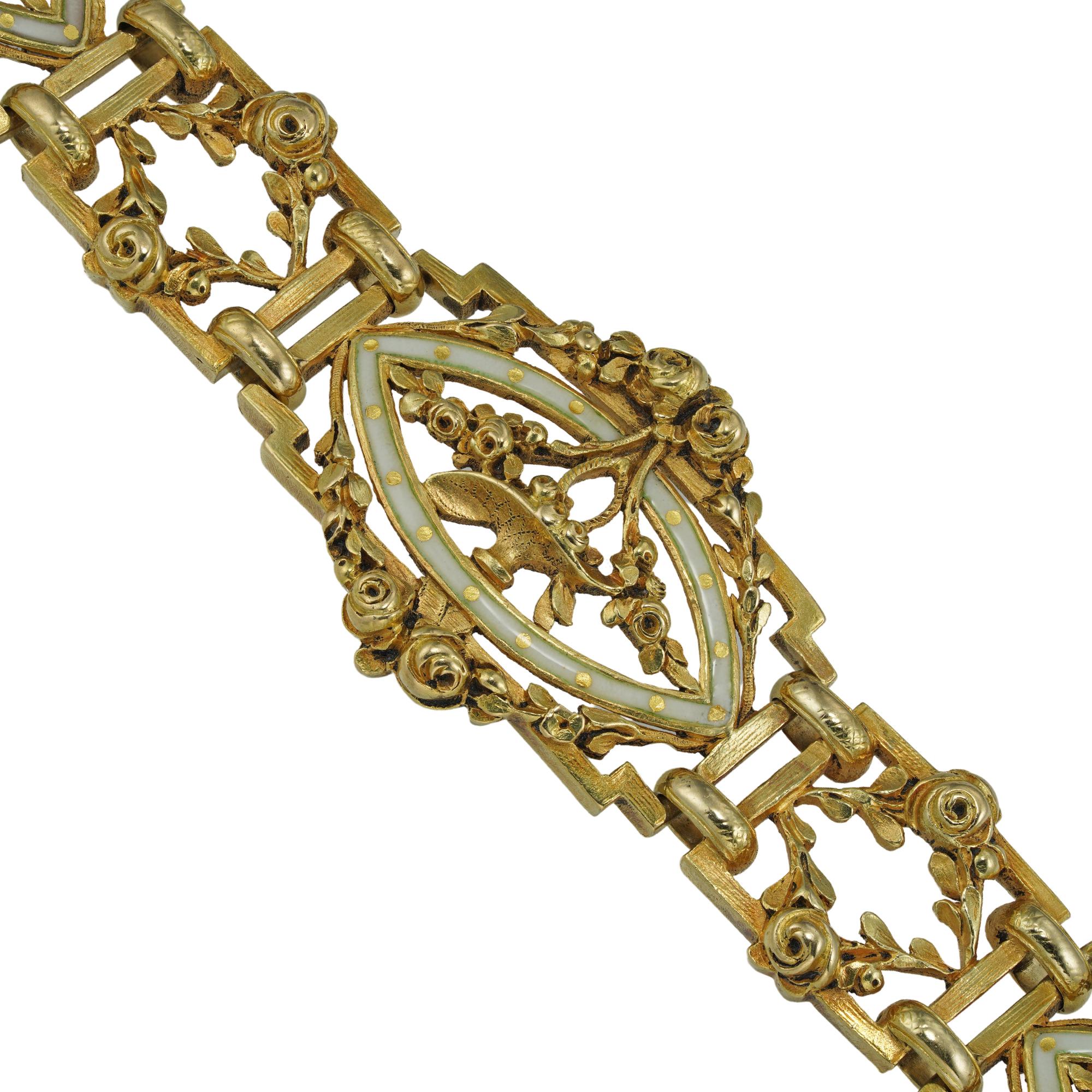 A Belle Époque gold and enamel bracelet, consisting of five cartouche-shaped links of openwork design, each depicting to a basket of flowers surrounded by an ivory colour enamel frame with floral garland-style decorations, connected with five