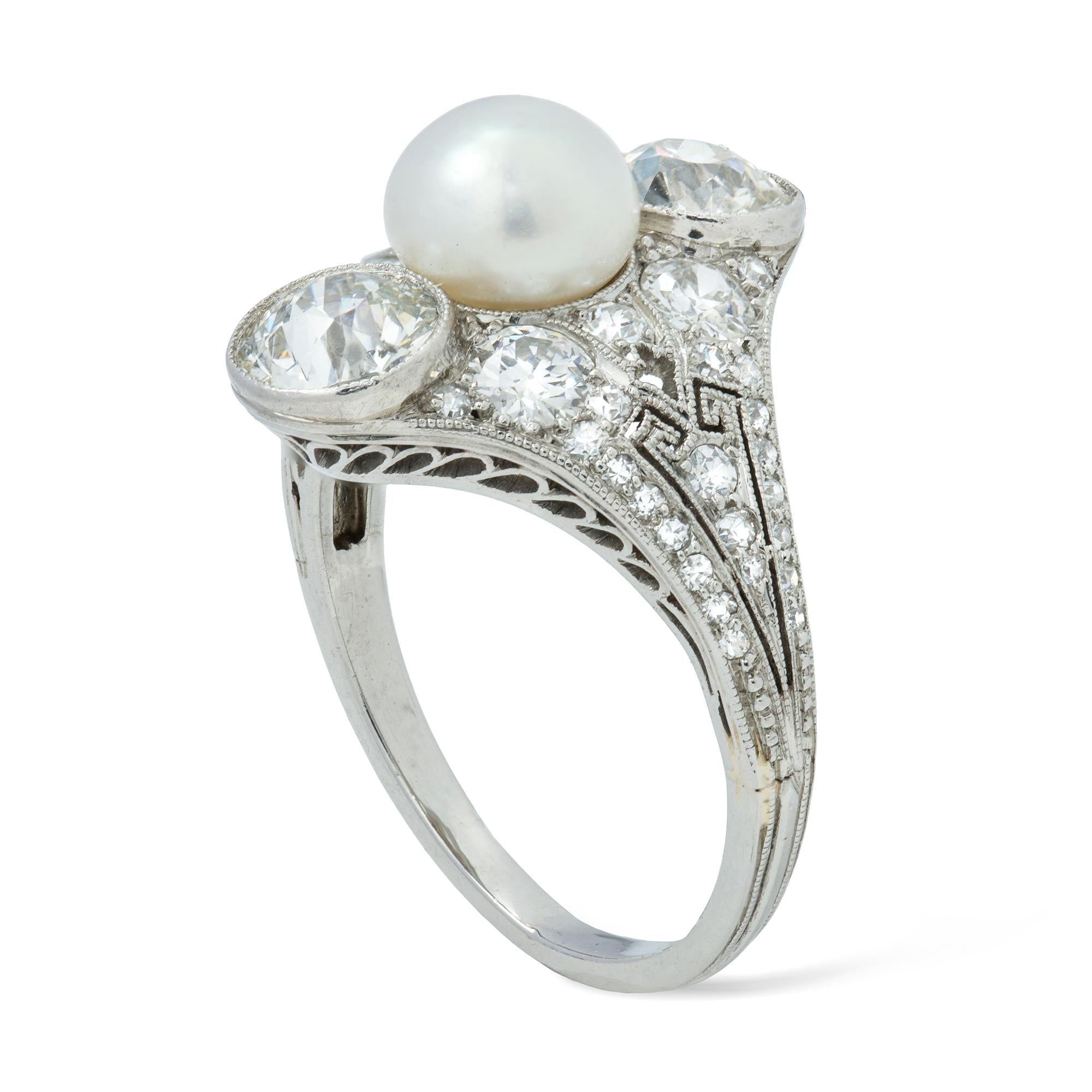 A Belle Époque natural pearl and diamond ring, the vertically set three stone pearl, accompanied by a Gem and Pearl Laboratory certificate stating the 1.95 carats pearl to be a natural saltwater, and two old brilliant-cut diamonds either side