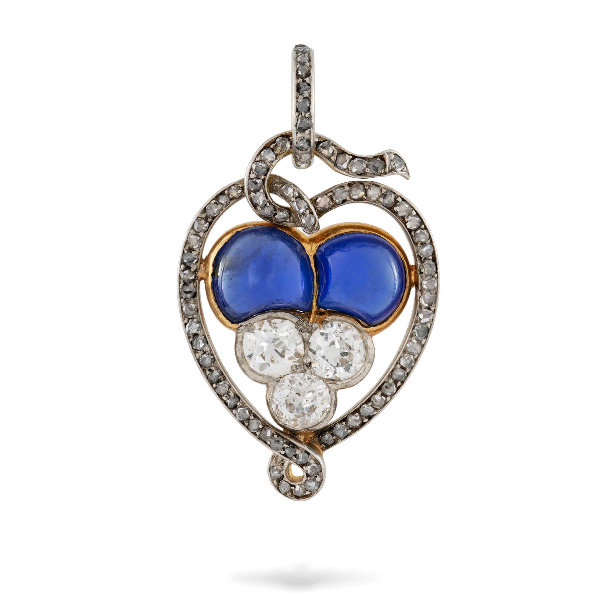 A Belle Epoque sapphire and diamond pendant, in the style of Bolin, to the centre two cabochon-cut sapphires estimated to weigh 3.2 carats in total, accompanied by GCS report, stating to be of Burmese origin with no indication of heating, with three