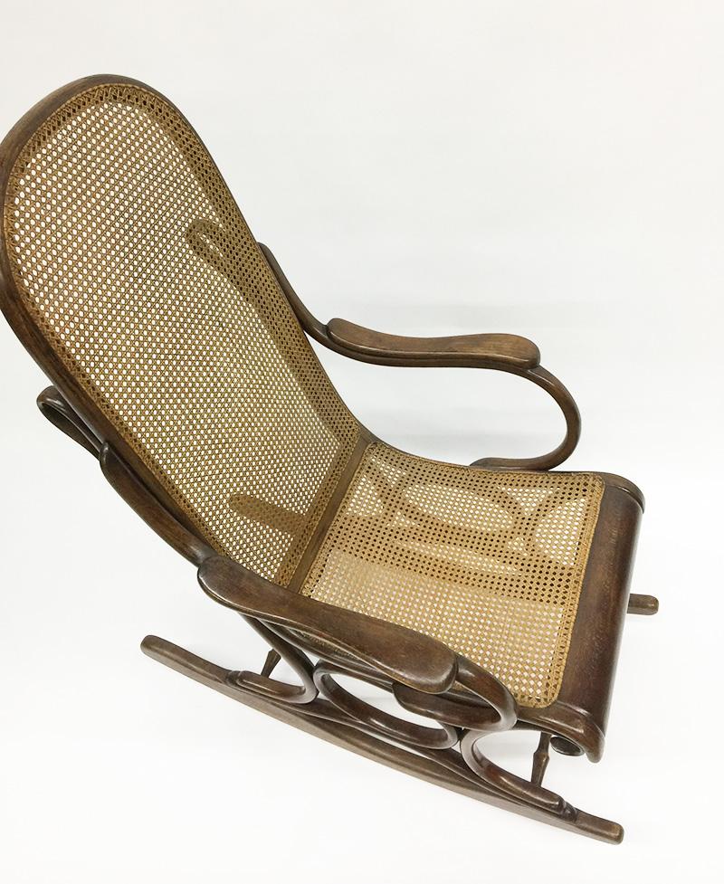Bended beechwood rocking chair with rattan seat, circa 1900

An English wooden bended rocking chair with rattan seat in beech wood circa 1900, England
Beautiful dark colored wooden chair with rattan which from the seat continues to the back
The seat