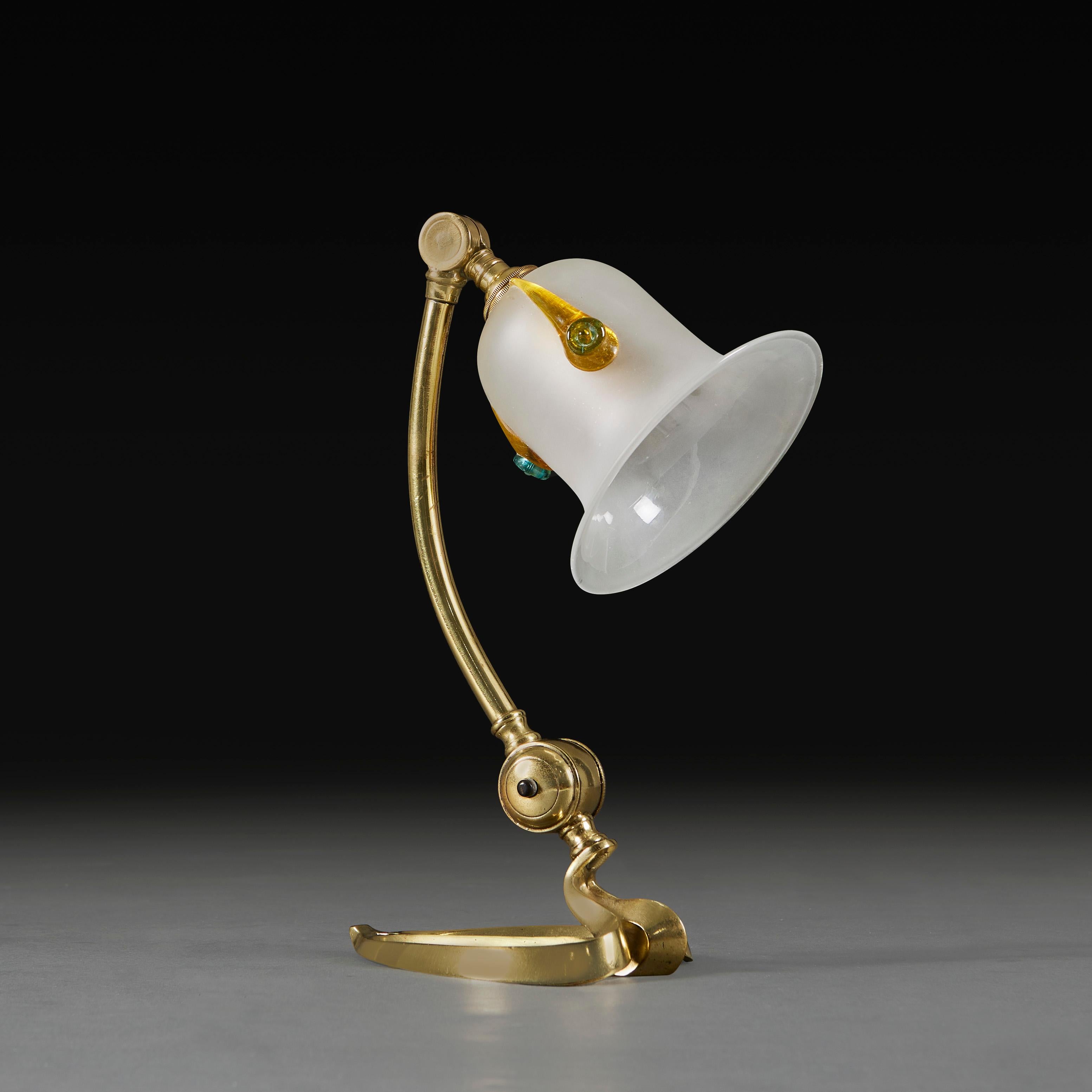 England, circa 1900

An articulated brass lamp with heart shaped base, with brass screw to the neck, to be used as a desk lamp or mounted on the wall. Attributed to W.A.S Benson. 

Please note: This is currently wired for the UK with BC bulb