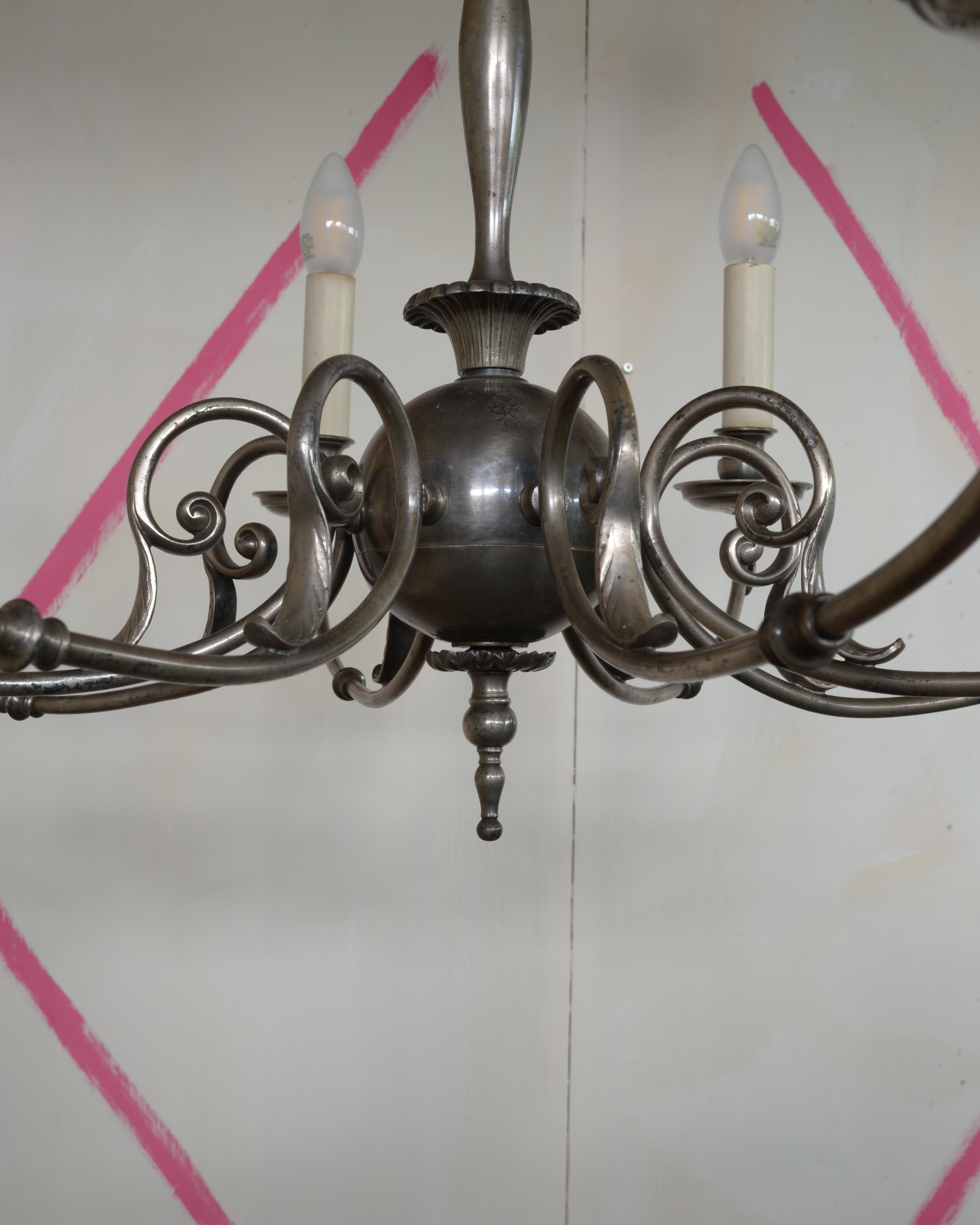 Fatto a mano A Berlin Deko Eight Light Chandelier Made of a Silver Toned Alloy in vendita