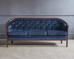 A Bertil Fridhagen Sofa in walnut & velvet circa 1960