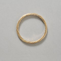A Bi-Color 18k Gold Van Cleef & Arpels Bangle