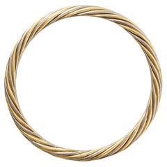 A Bi-Color 18k Gold Van Cleef & Arpels Bangle
