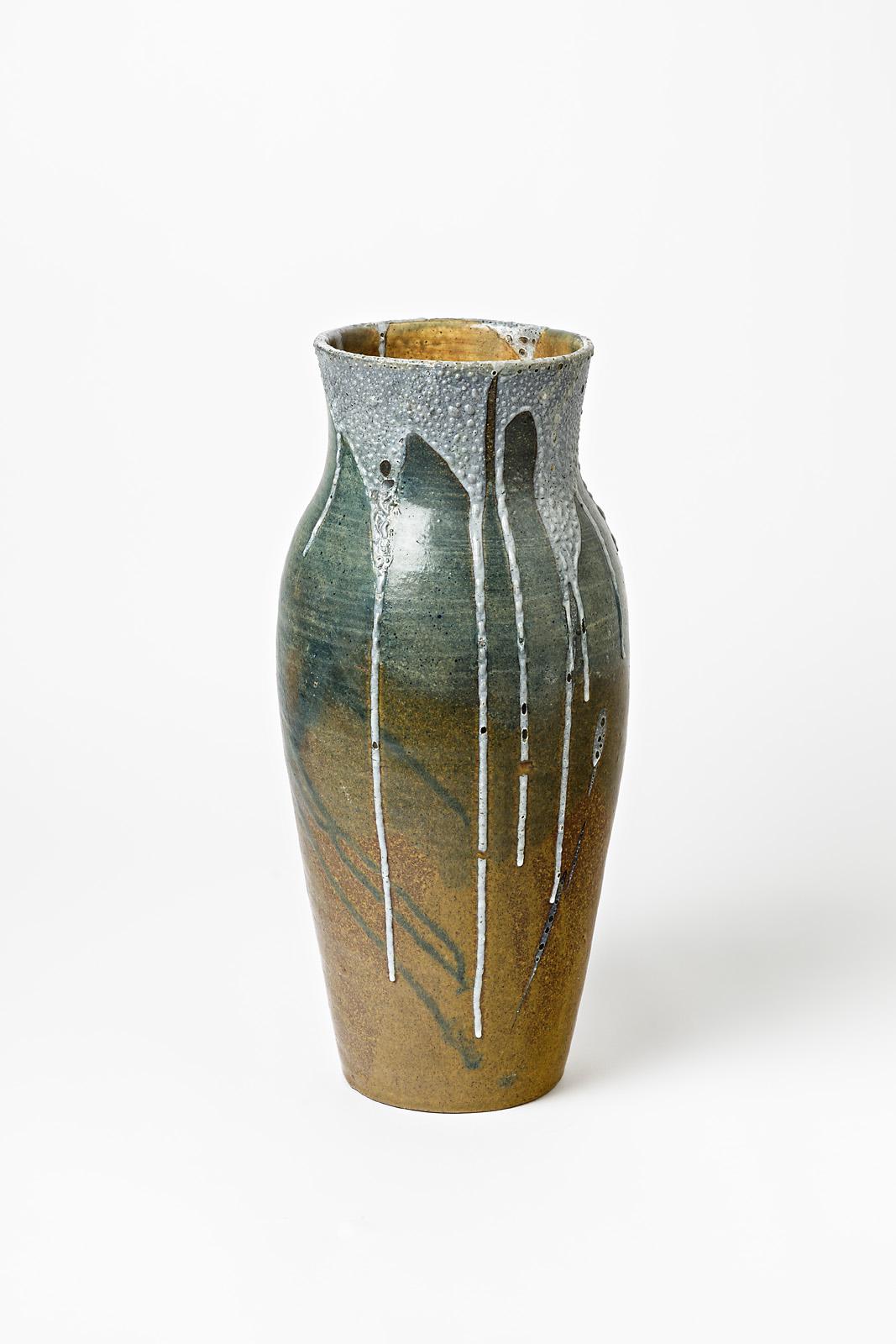 A big ceramic vase by Eugene Lion with glaze decoration.
Signed under the base 