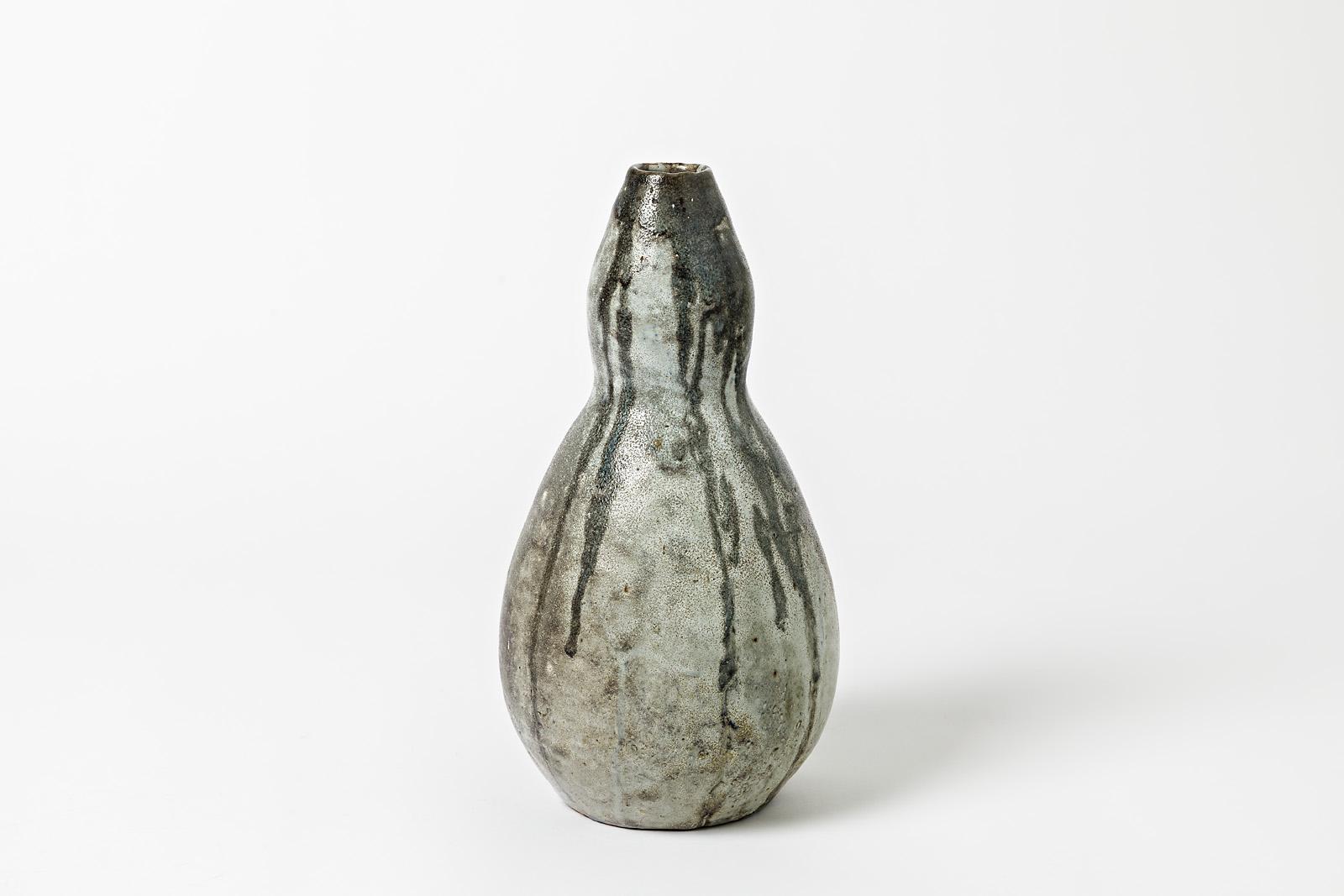 A ceramic vase by Eugene Lion with glaze decoration.
Signed under the base 