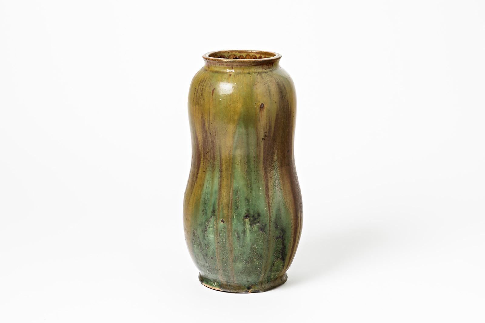 A ceramic vase by Lucien Arnaud with glaze decoration.
Signed under the base 