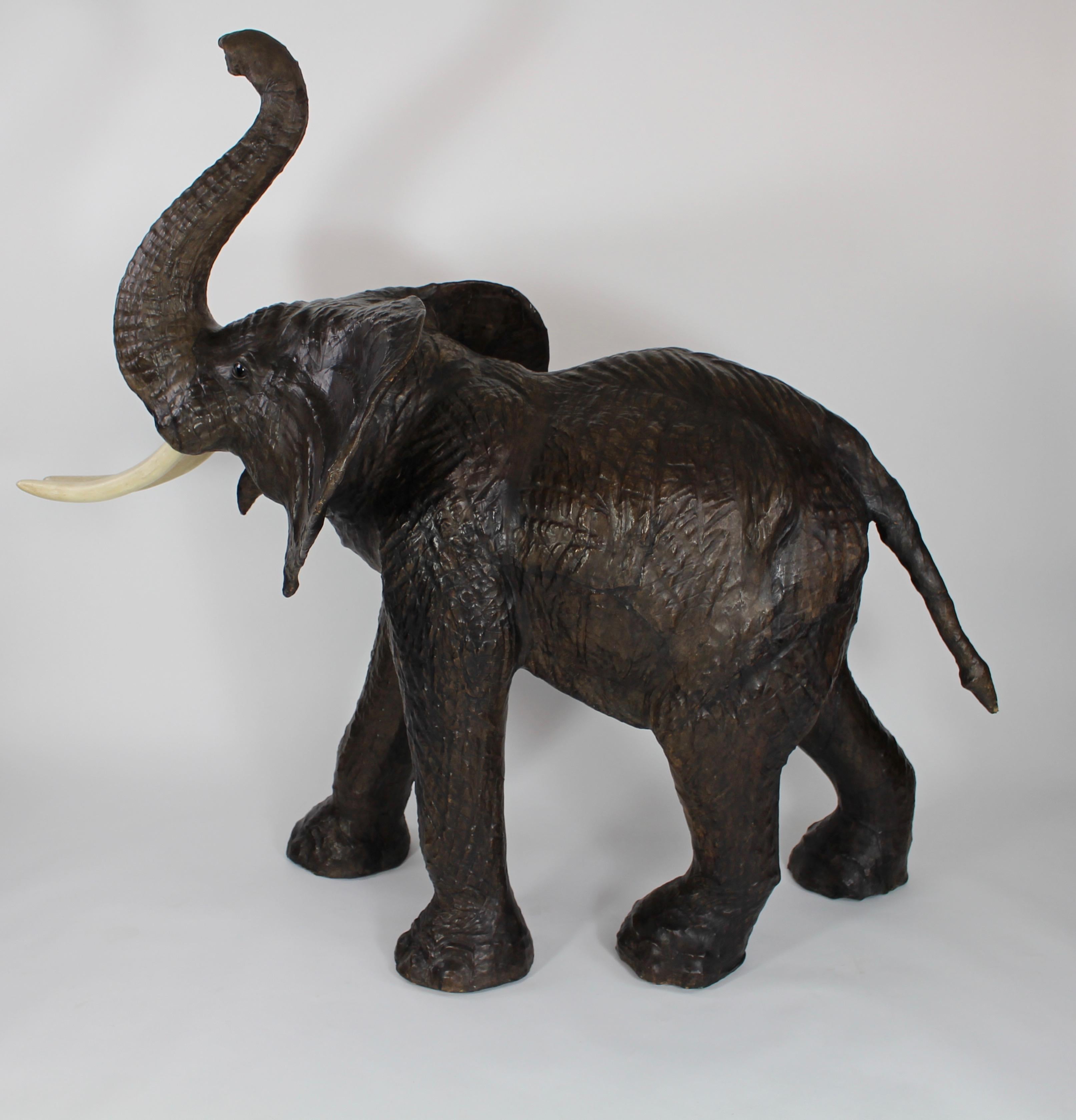 A large leather elephant with eyes made out of glass from the 1960's. 
In a fantastic vintage condition!