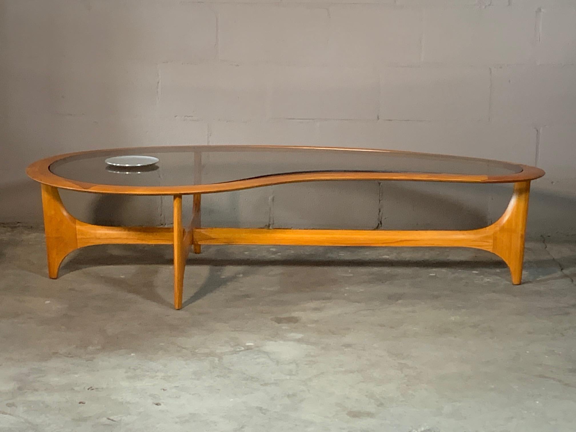 A classic biomorphic coffee table by Lane, circa 1960s. Made of elmwood, glass top. Completely restored with a beautiful hand rubbed finish.