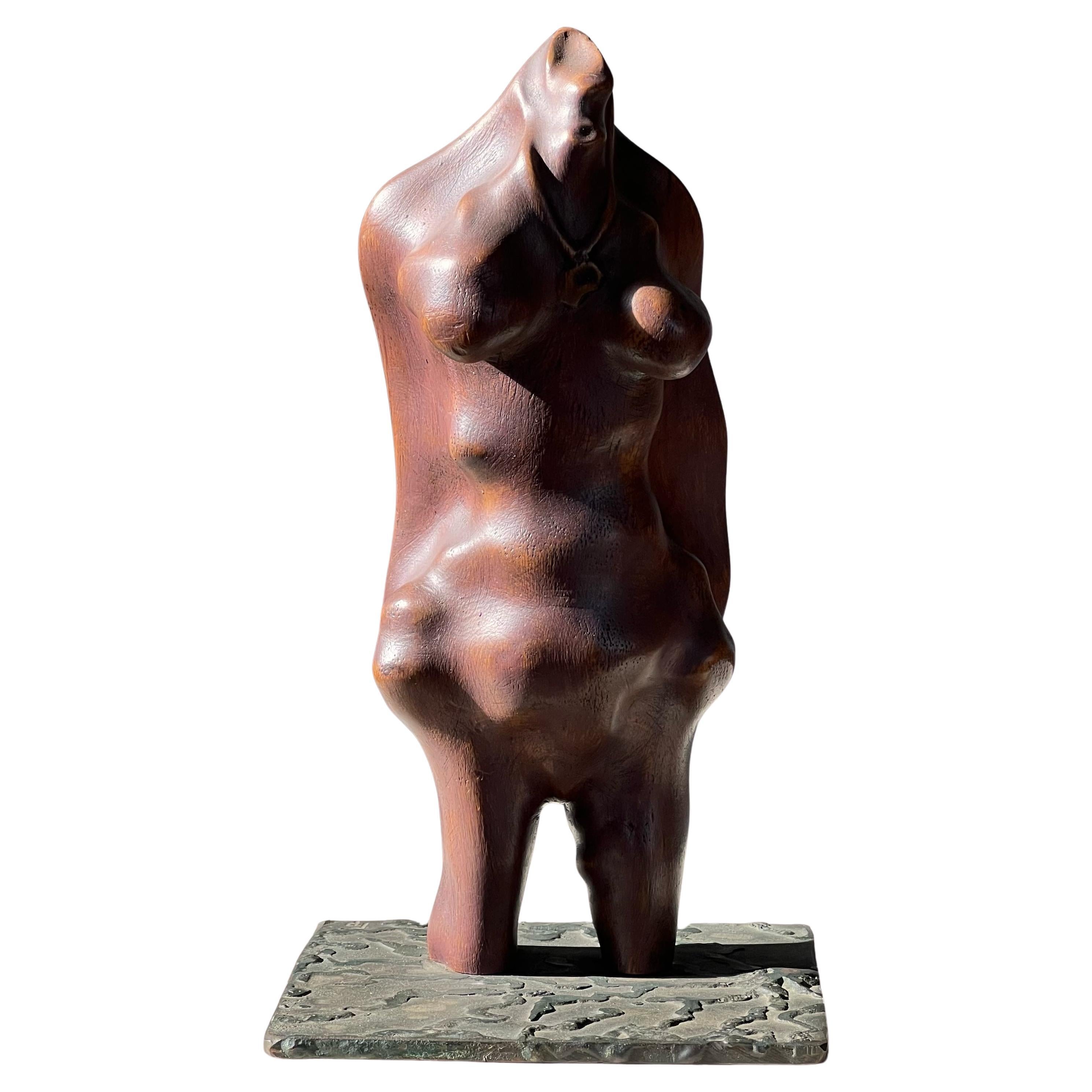 A biomorphic wood and iron sculpture of a woman, signed, mid 20th century For Sale