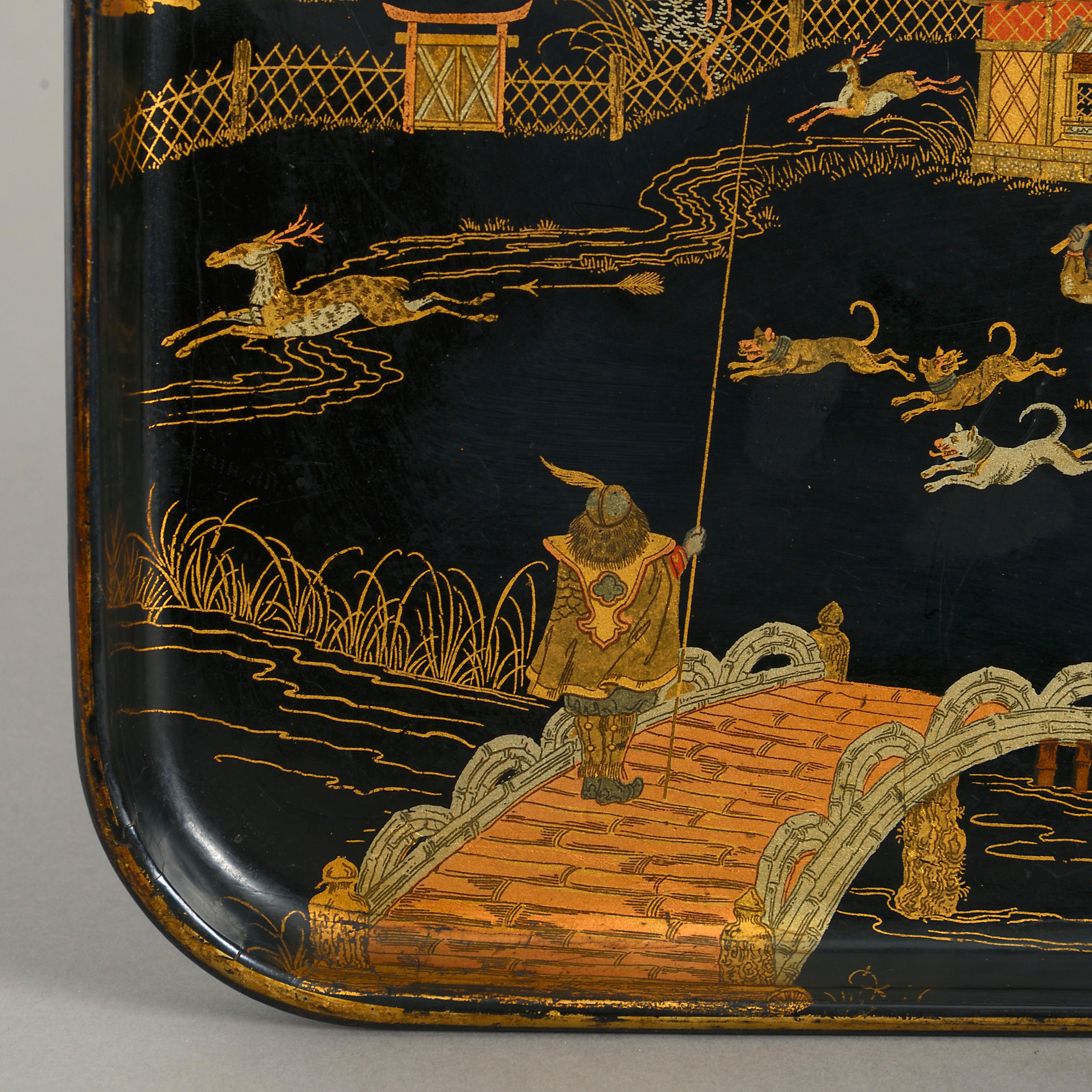 A late 19th century Meiji period black lacquer tray, of rectangular form, decorated throughout in various gilded tones, depicting a stag hunt.