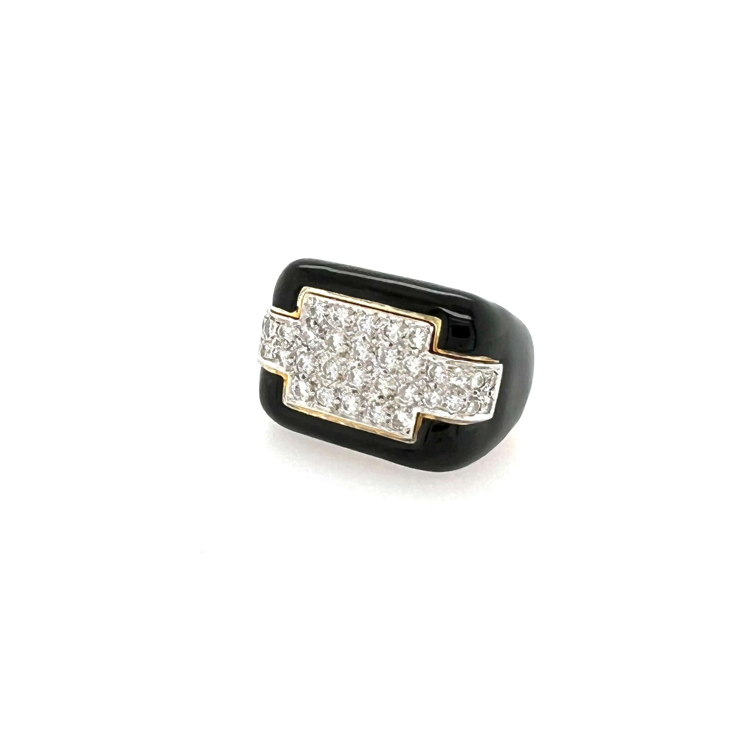 An 18 karat yellow gold, black enamel and diamond ring.  Fashioned with a rectangular top of black enamel set with a plaque of thirty six (36) brilliant cut diamonds.  Total diamond weight approximately 1.08 carats.  Size approximately 7.  Gross