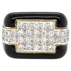 A Black Enamel, Diamond and Gold Ring.