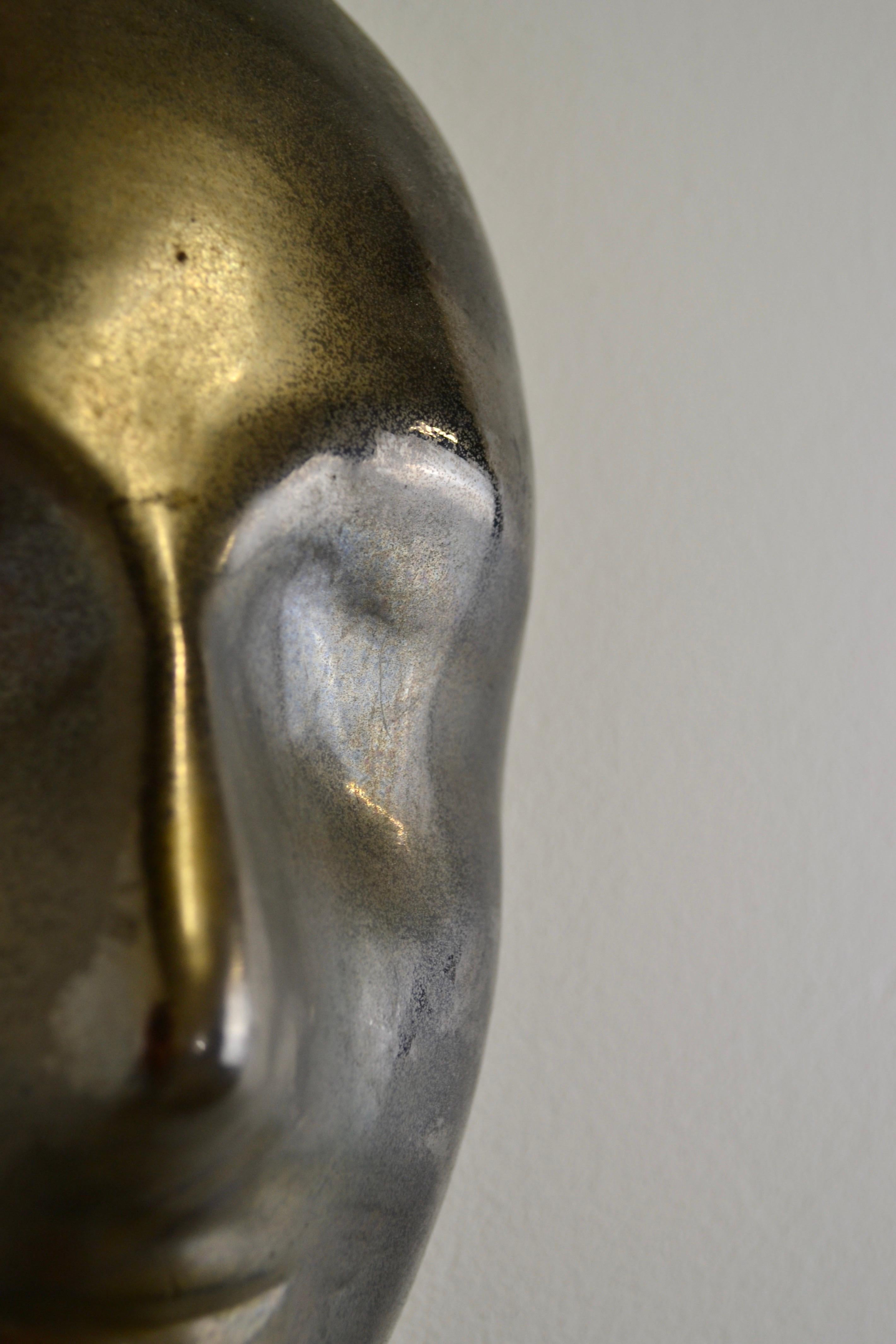 Mid-Century Modern A black enamelled ceramic mask with bronze-gold highlights France 1950s For Sale