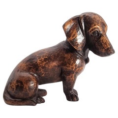A black forest finely hand carved limewood study of a puppy dachshund circa 1930