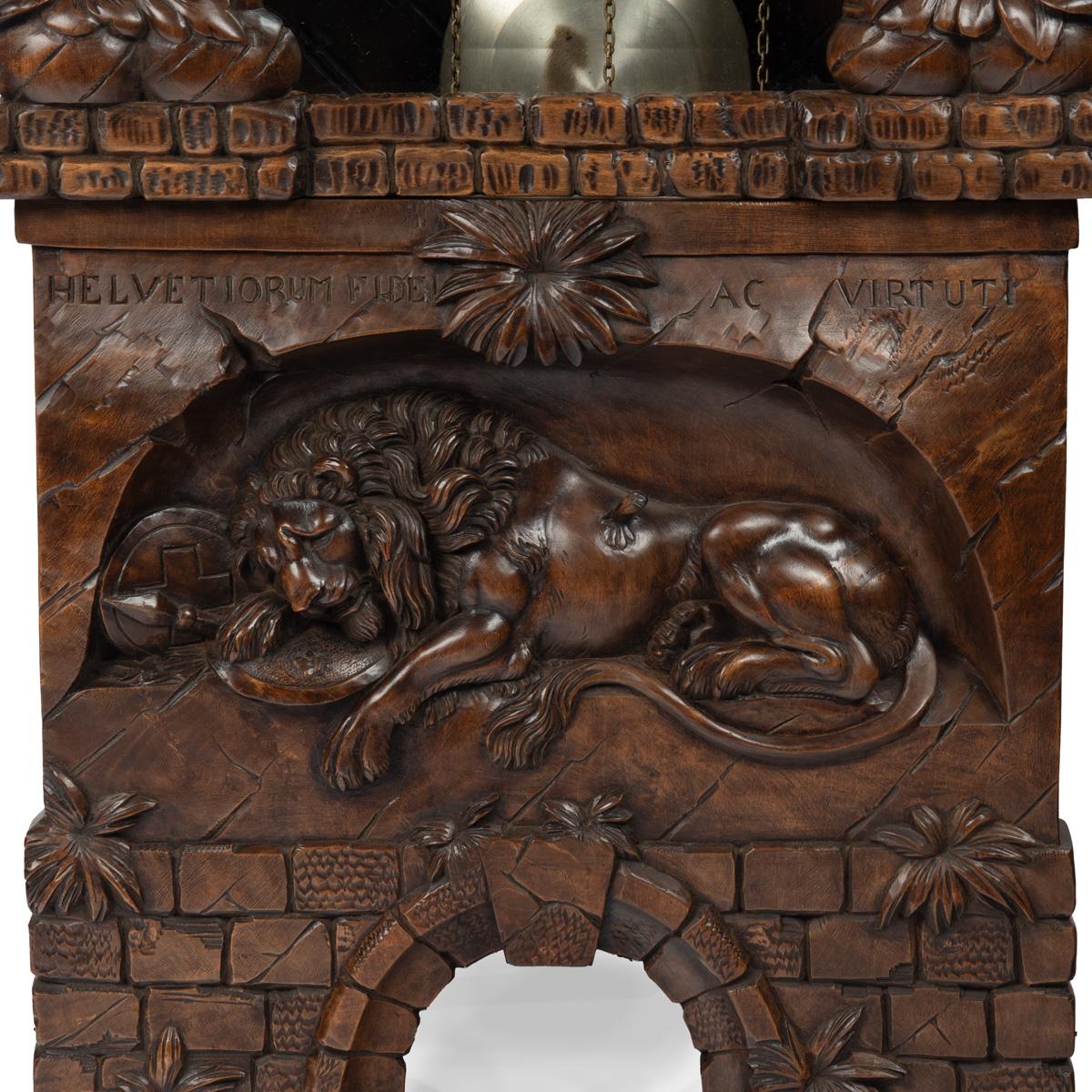 A ‘Black Forest’ linden wood long case clock by Spring of Interlaken For Sale 5