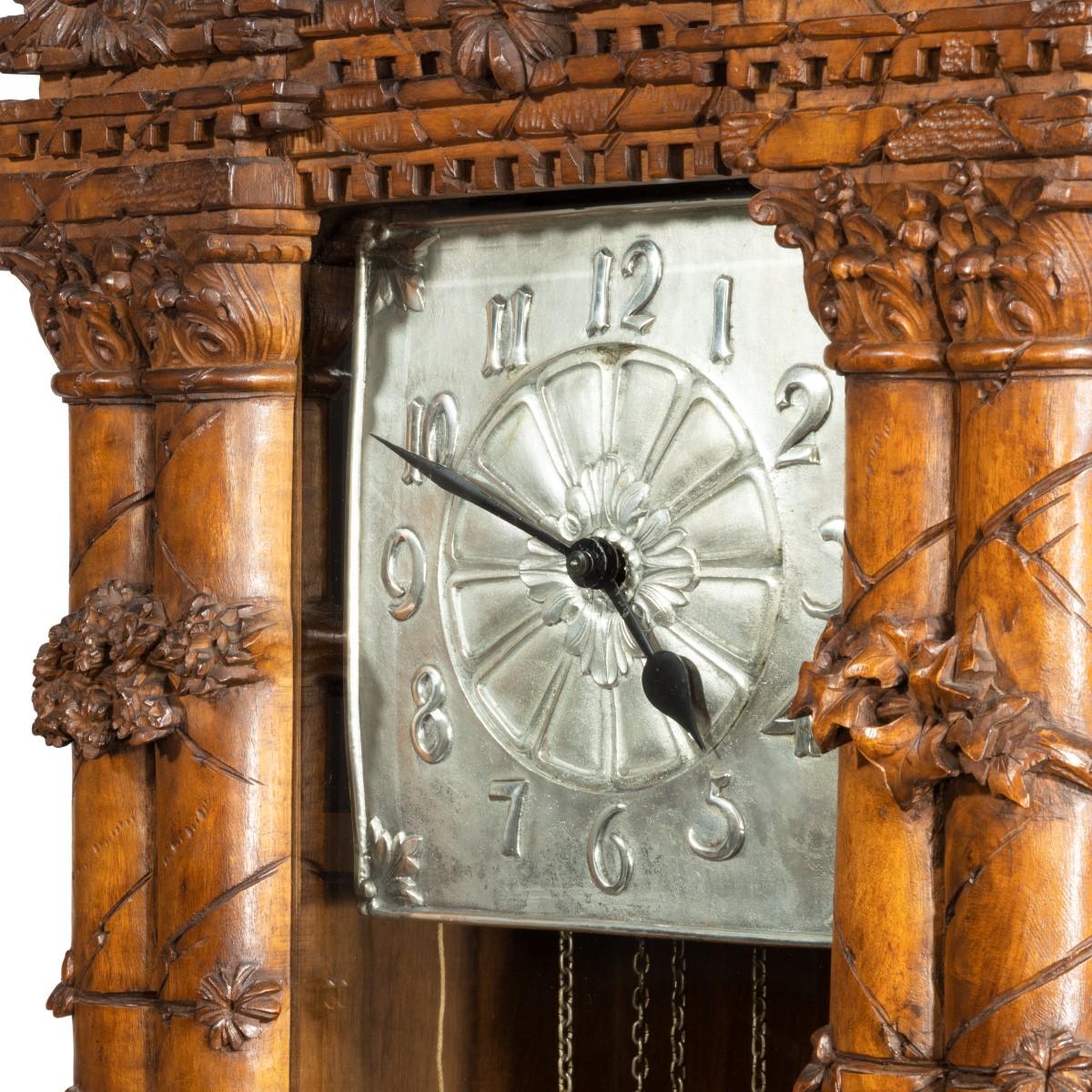 Swiss A ‘Black Forest’ linden wood long case clock by Spring of Interlaken For Sale