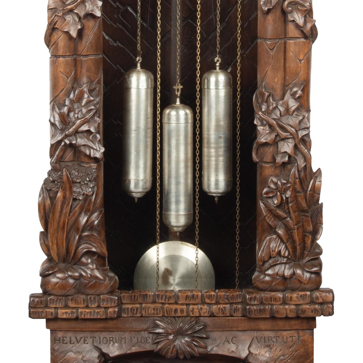 A ‘Black Forest’ linden wood long case clock by Spring of Interlaken For Sale 3