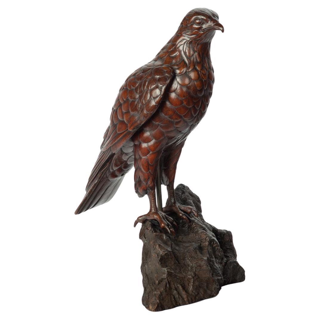 A Black Forest linden wood model of a hawk