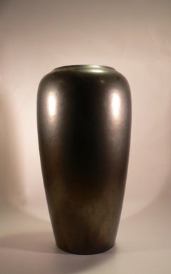 A black glazed ceramic vase from the 1970s.