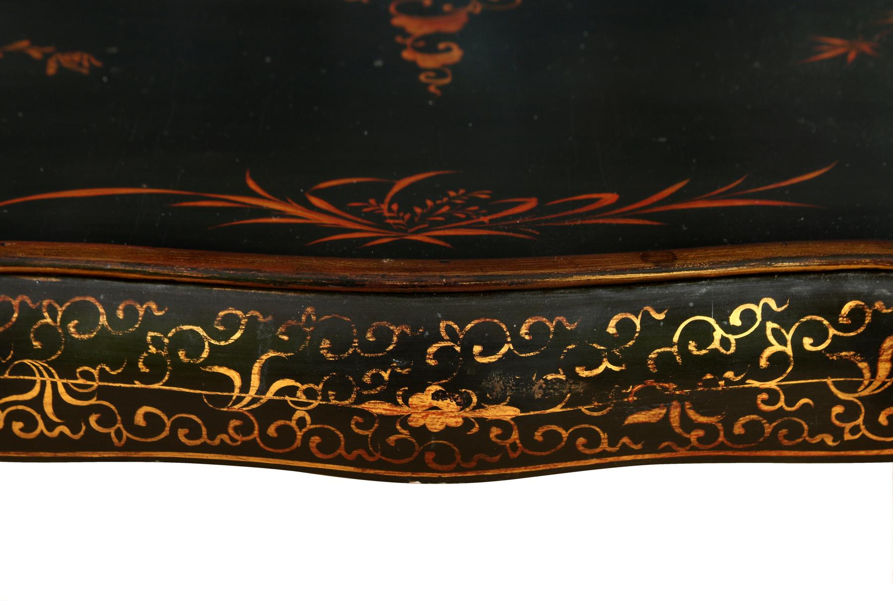 20th Century A Black Lacquer and Gold Cocktail Table For Sale