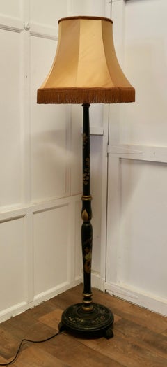 A Black Lacquer and Gold Decorated Standard Lamp