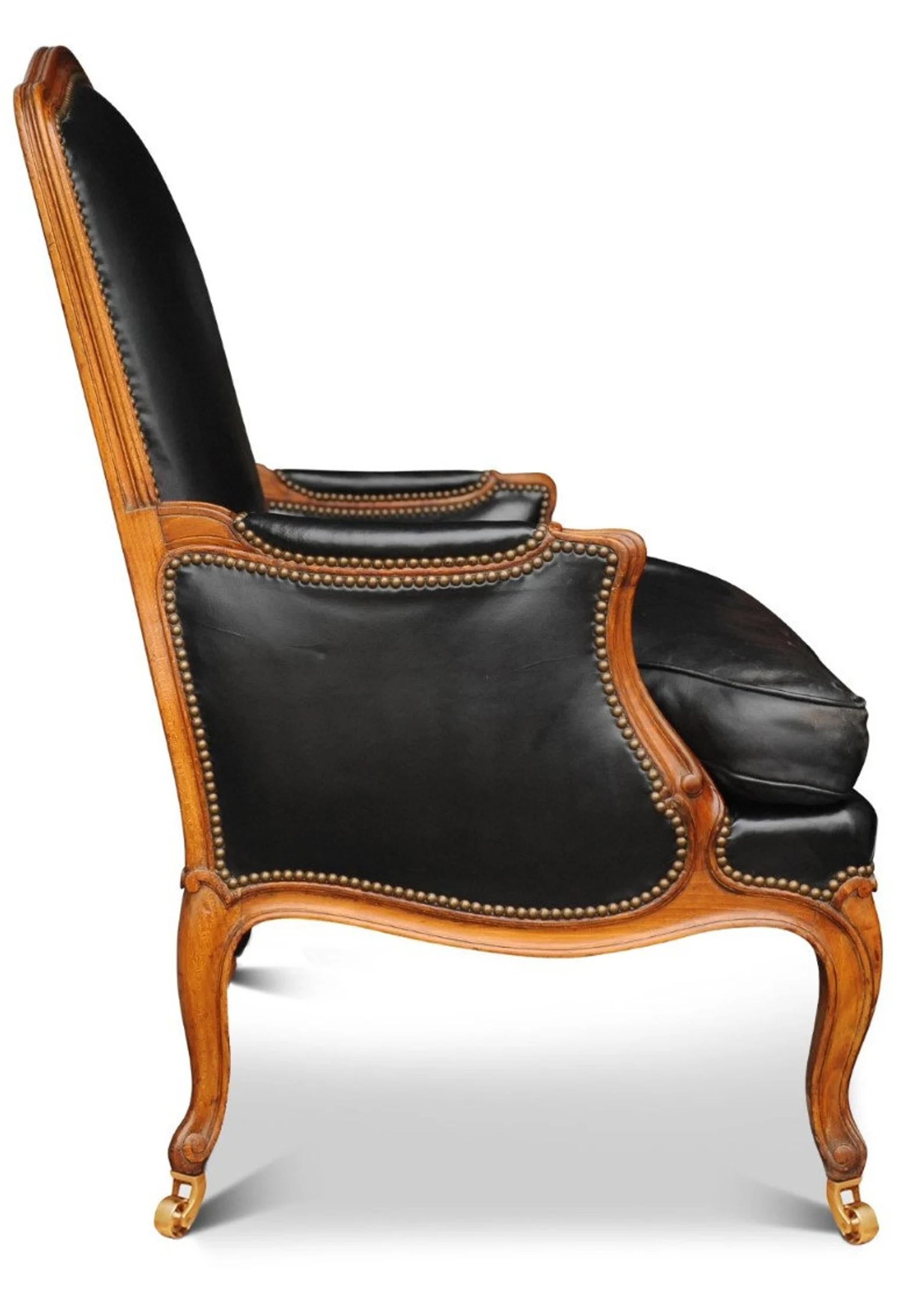 British Black Leather Louis XV French Bergere Armchair Finished with Brass Stud Detail For Sale