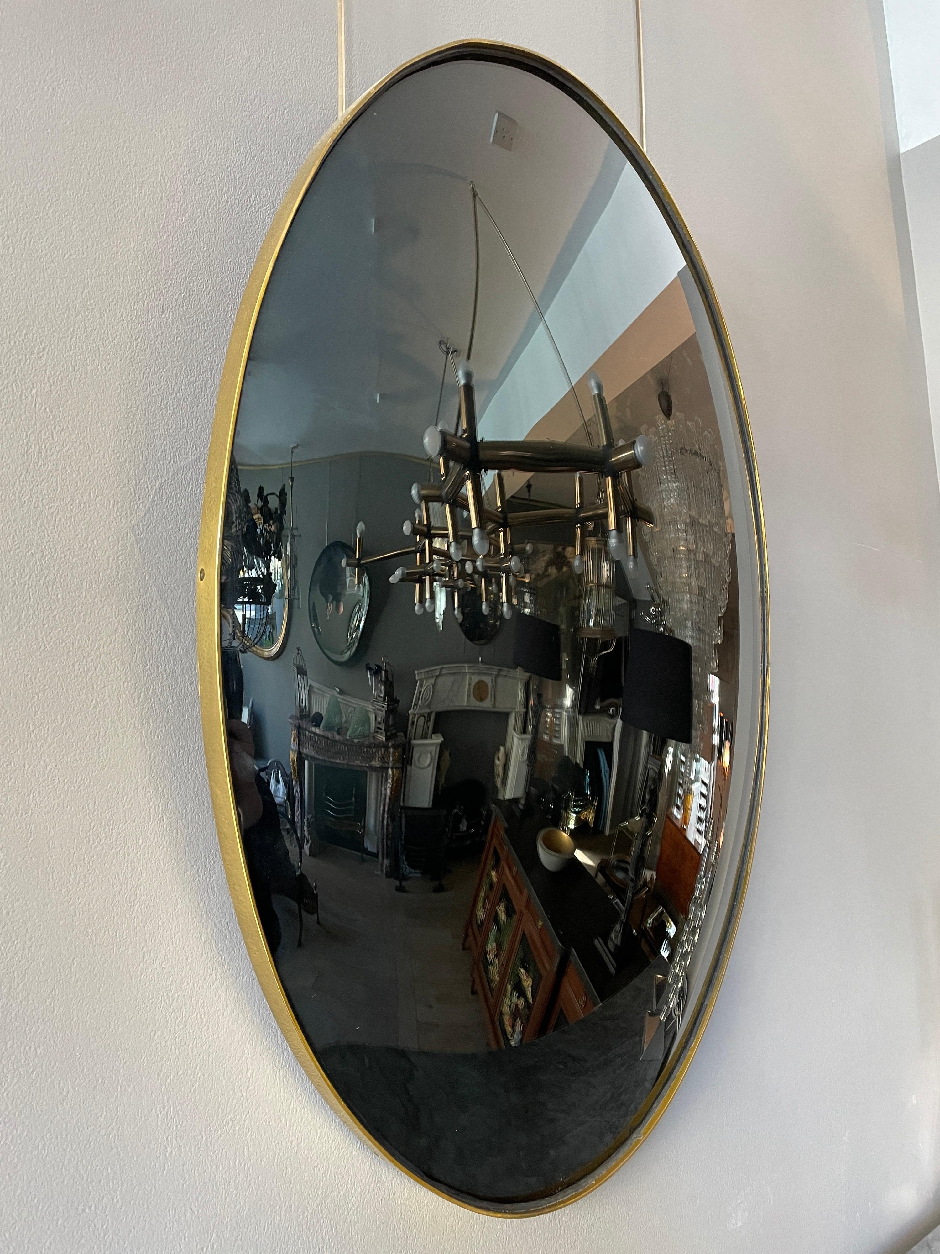 Mid-Century Modern Black Glass Convex Oval Mirror For Sale