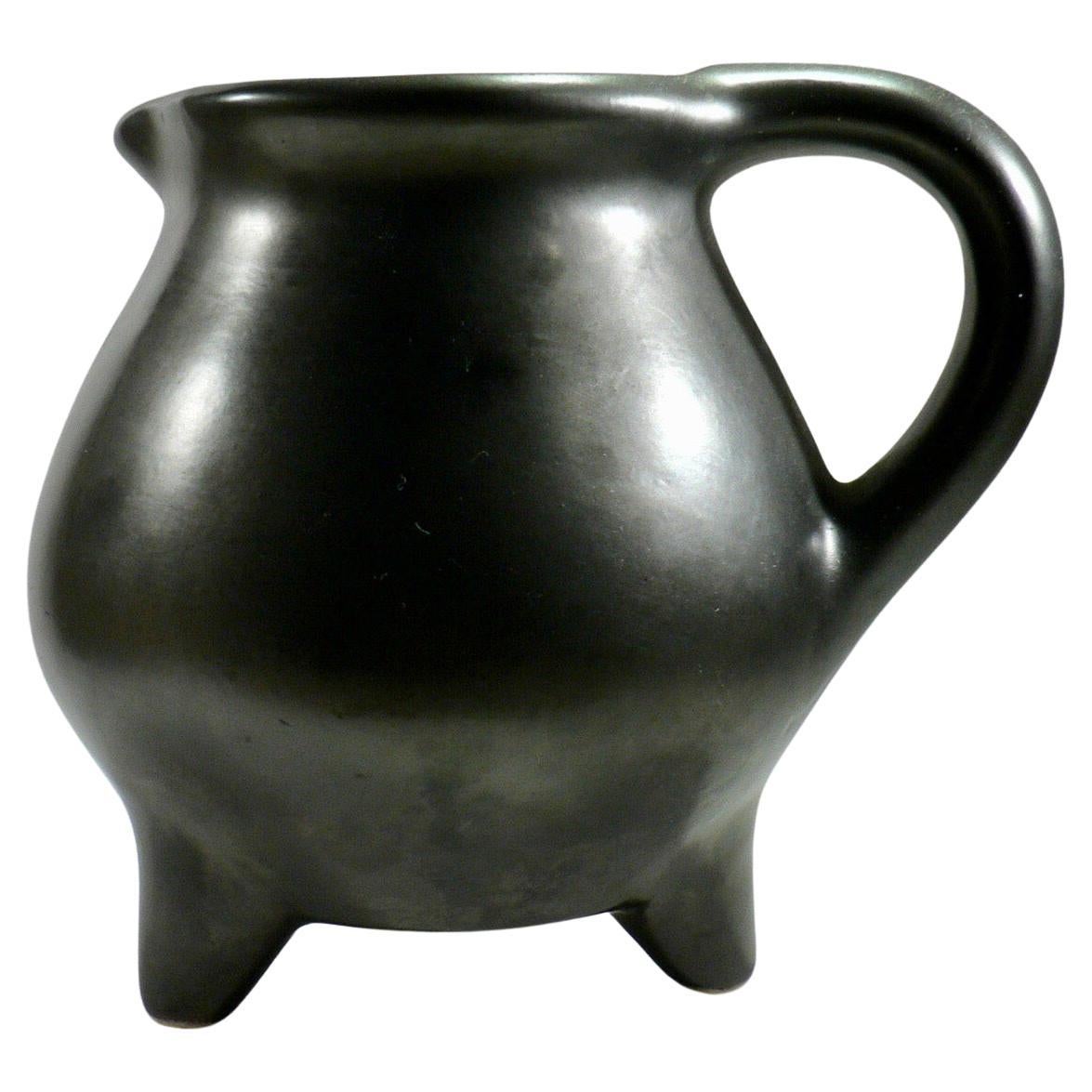 A black pitcher with a tripod base from Périgord pottery France 1950 For Sale