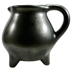 A black pitcher with a tripod base from Périgord pottery France 1950