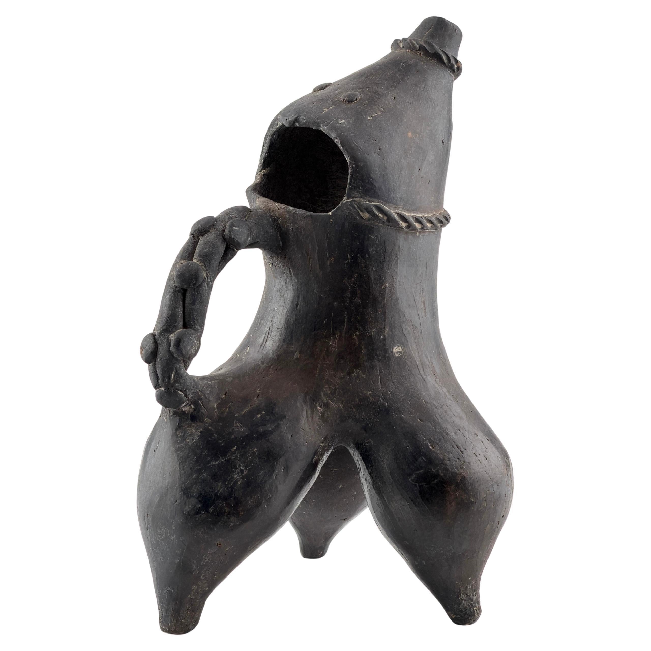 A Black Pottery Tripod Ewer