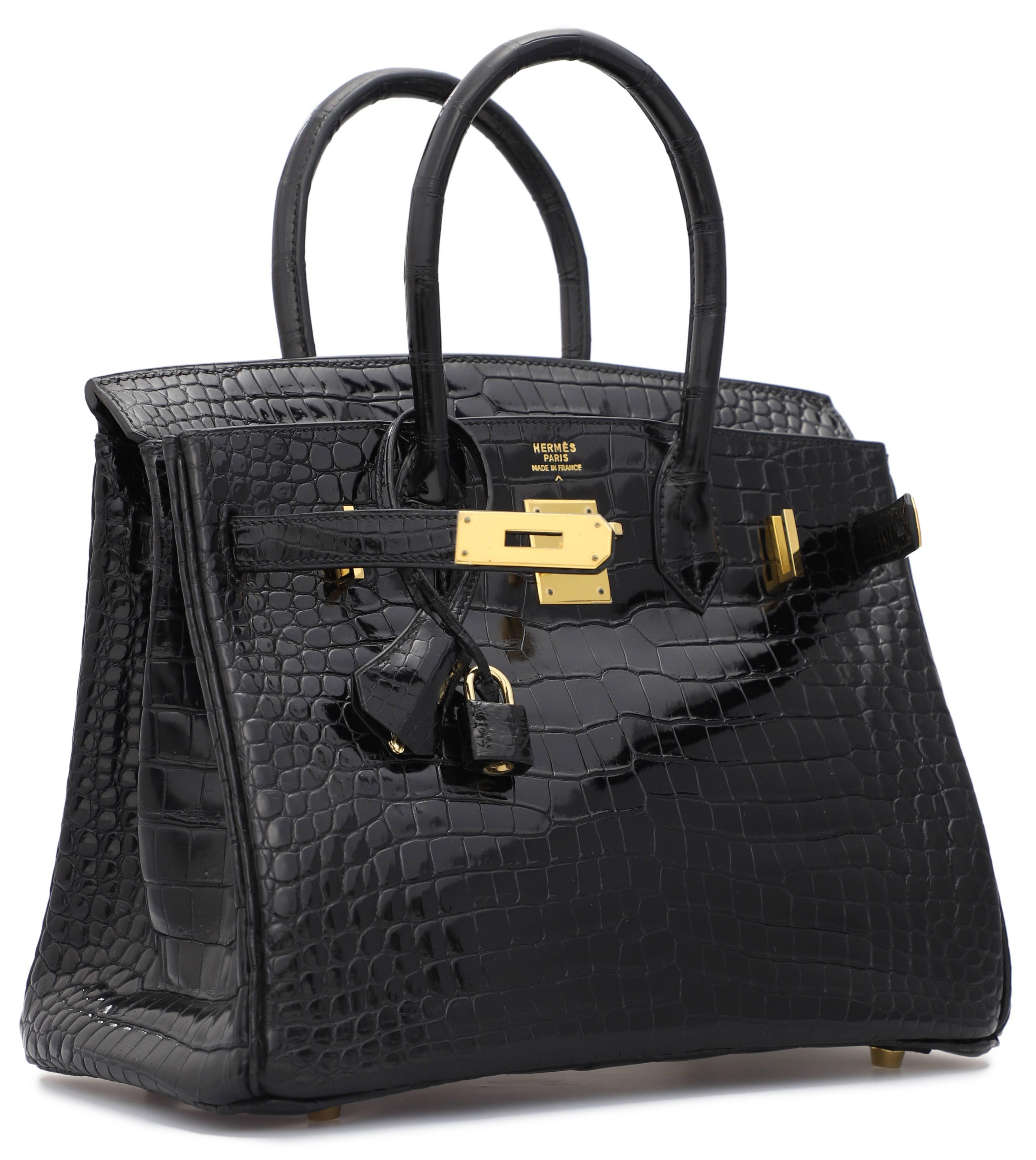 A Black Shiny Porosus Crocodile Birkin 30. Extraordinary Condition for this beautiful vintage piece, plastic protections still on front hardware. Stamp D in Square. Year 2000. Exhibits very light wear on the feet and on leather in the back. Includes
