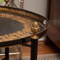Black Tole Table with Decorative Oval Top and X-Frame Bases