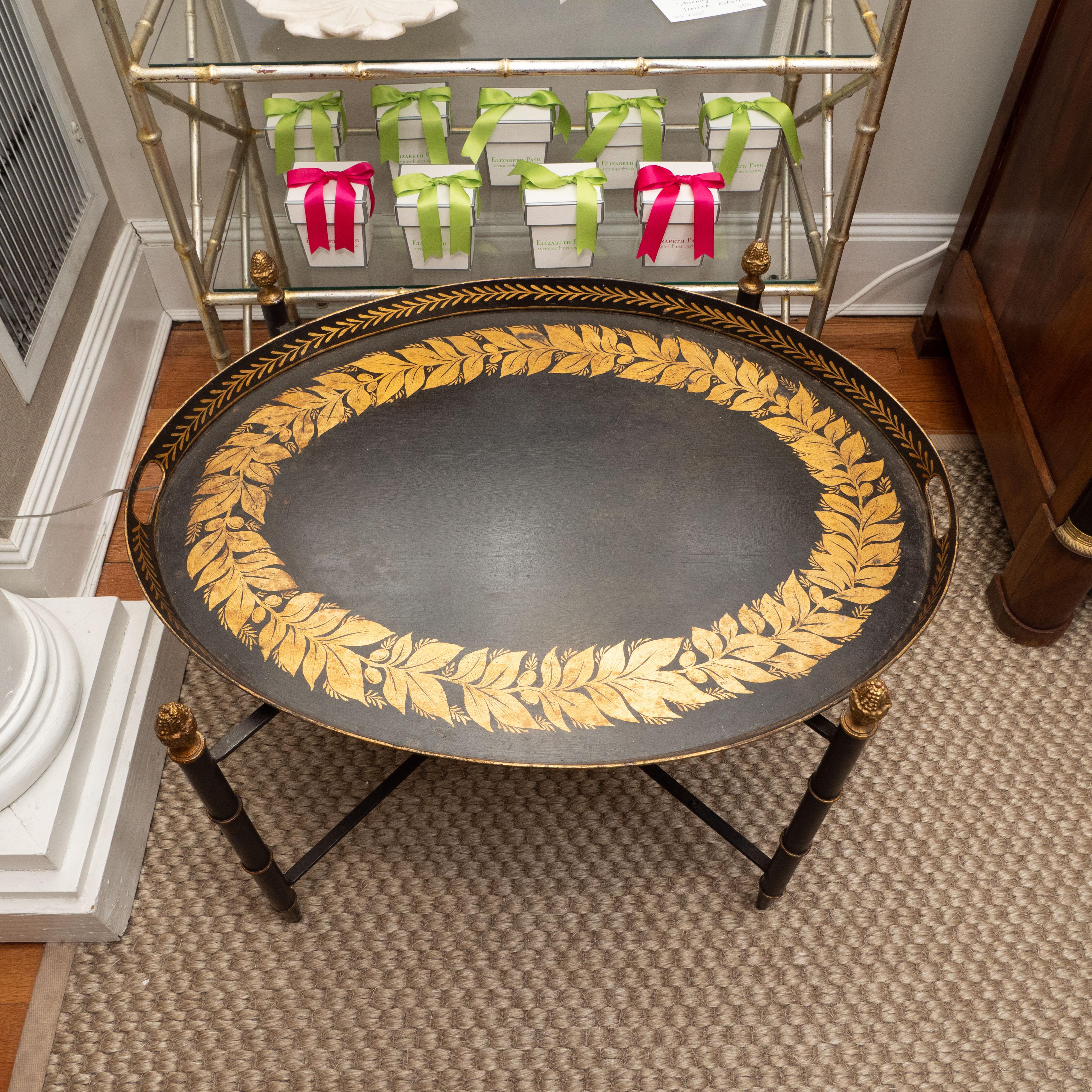 Unknown Black Tole Table with Decorative Oval Top and X-Frame Bases