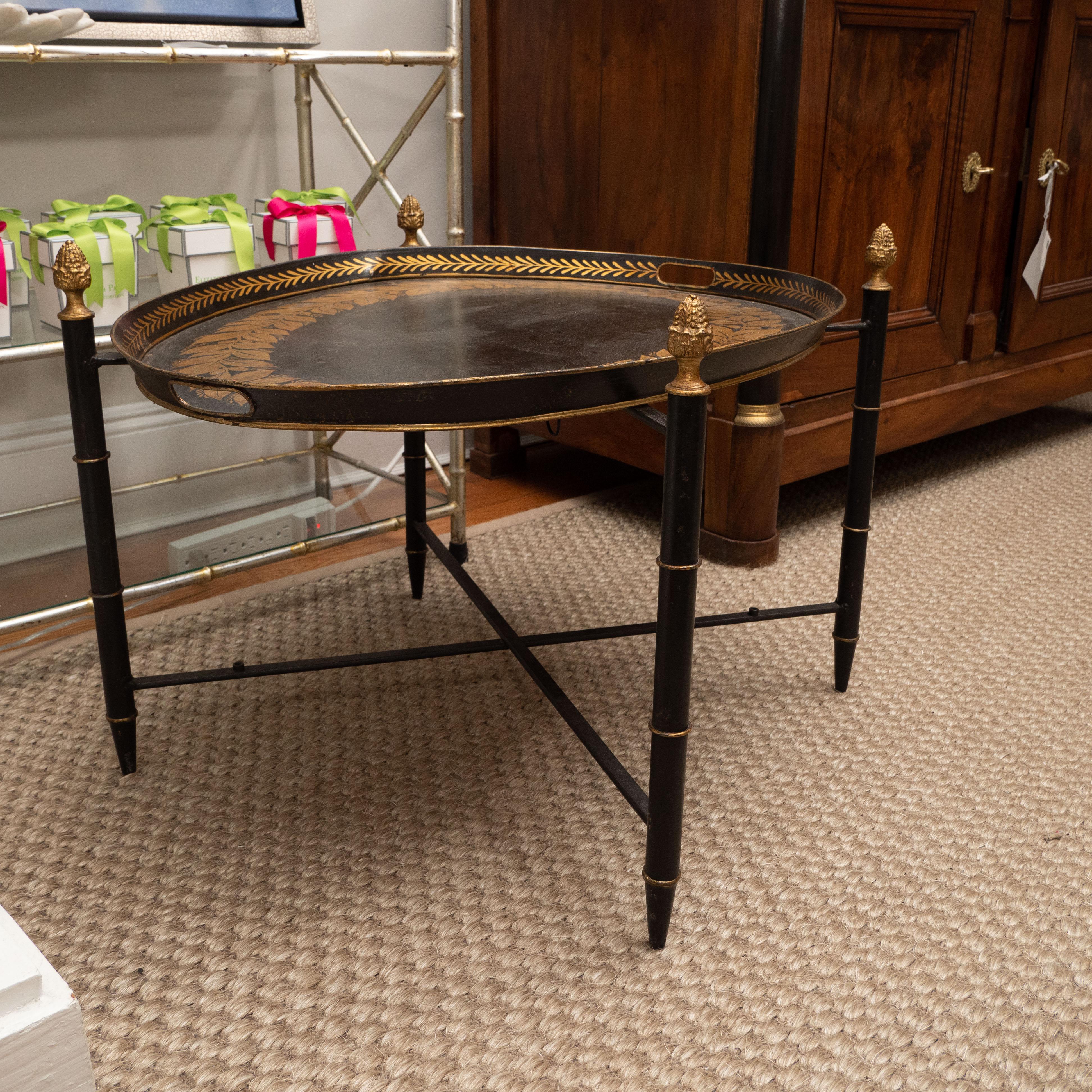 Black Tole Table with Decorative Oval Top and X-Frame Bases 1