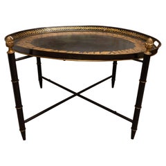 Vintage Black Tole Table with Decorative Oval Top and X-Frame Bases