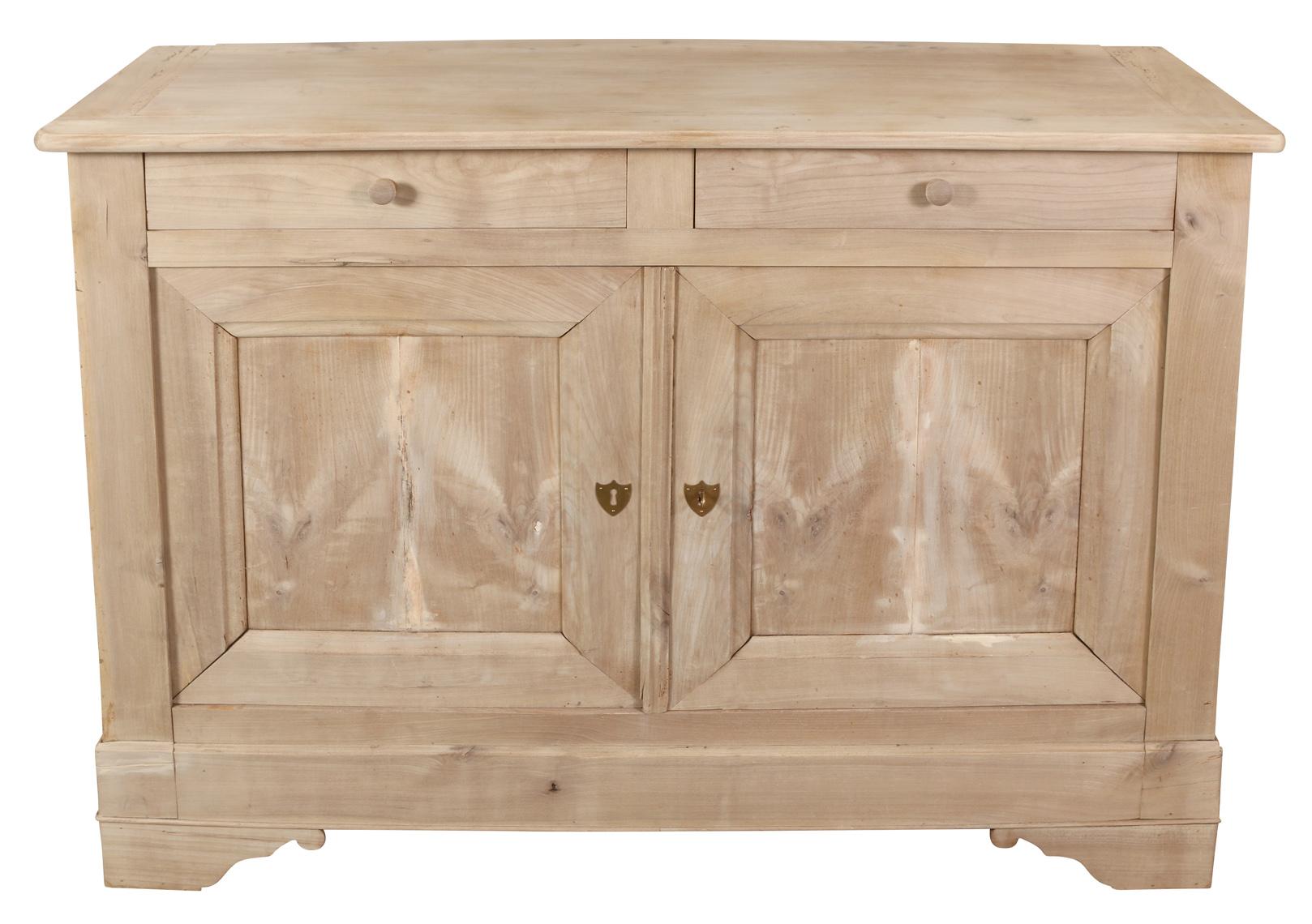 We like this buffet/server for its compact s size and clean lines. Raised on bracket feet, this useful piece features two drawers above two paneled doors.  The bleached finish gives the piece a more contemporary, fresh look.  Perfect as a dining