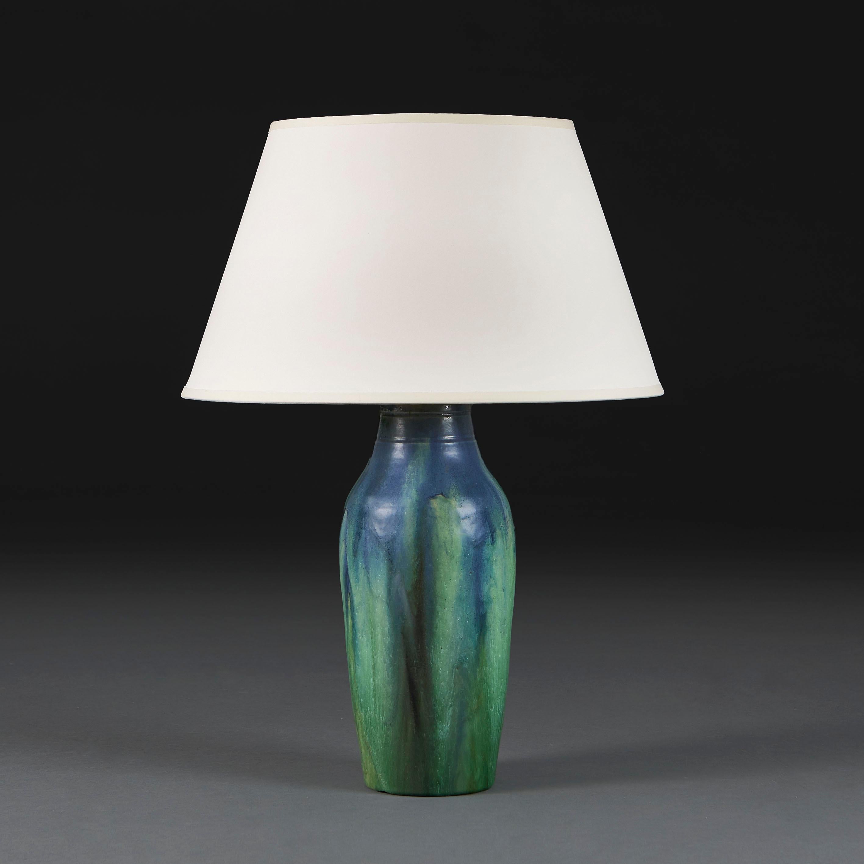 France, circa 1940

A mid-century art pottery vase with blue and green drip glaze to the surface, with bottle neck form, now converted as a lamp.

Photographed with a 16” Pembroke lampshade in pale cream card.

Currently with for the UK with BC bulb
