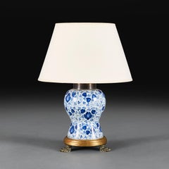 A Blue and White Delft Ceramic Lamp with Hairy Paw Feet