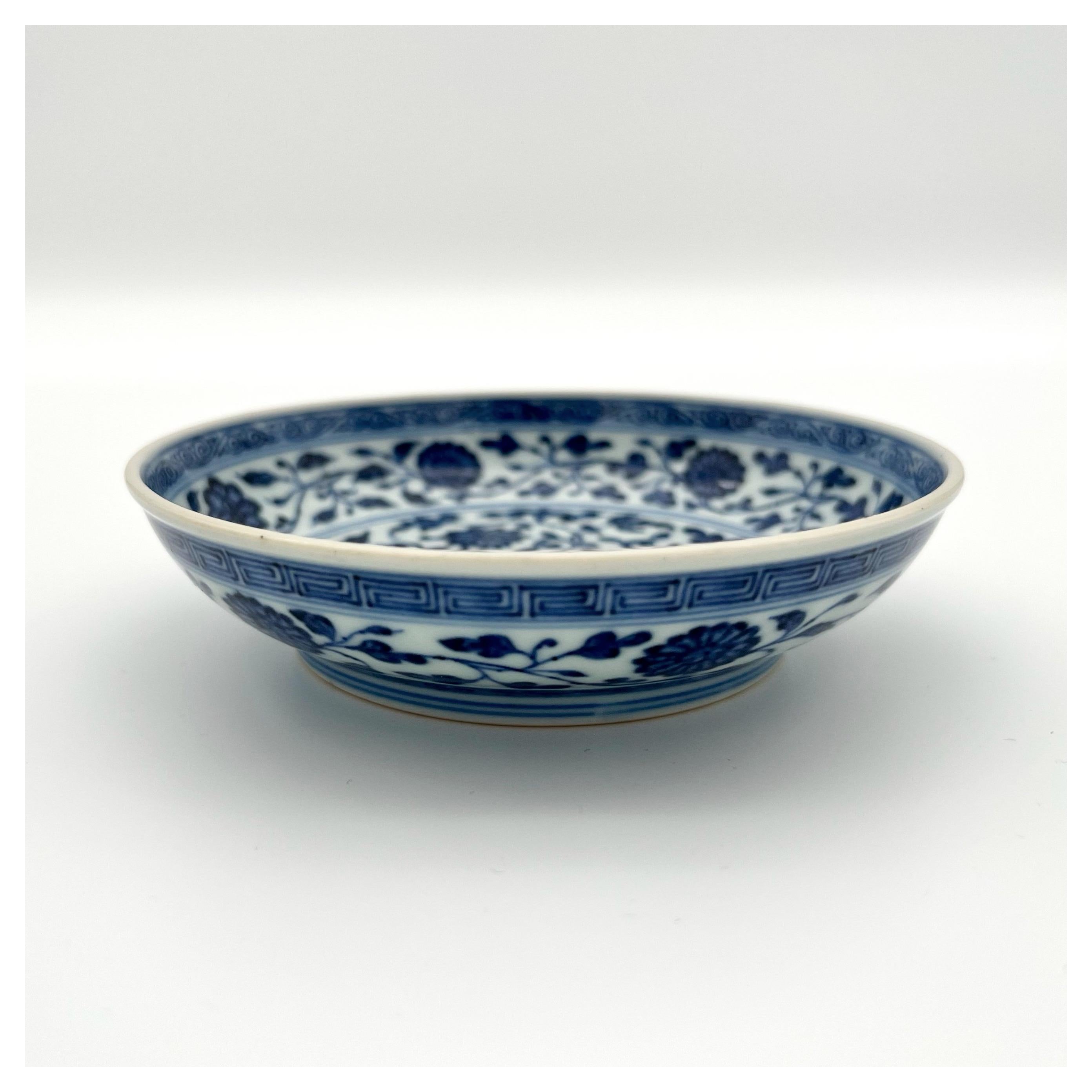 A blue and white Ming-Style dish, Qianlong Mark And Period. China 1736-1795.

The base with an underglaze blue six-character seal mark da Qing Qianlong nianzhi and of the period. Potted with rounded sides rising from a slightly tapered foot,