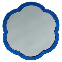 A blue art deco hexafoil mirror 
