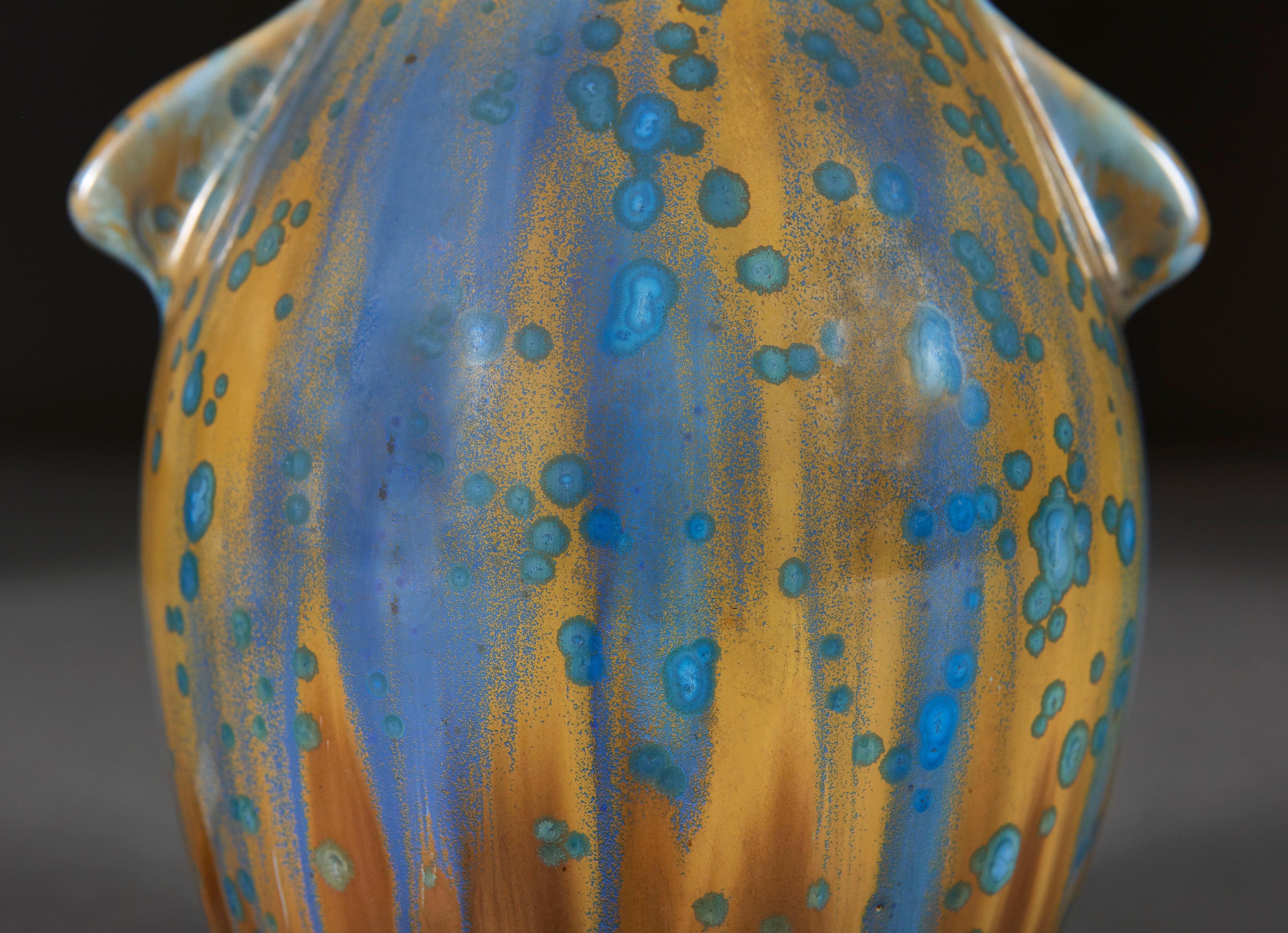 France, circa 1940

A mid century art pottery vase of small scale, with fine blue and ochre crystalline glaze, with handles to each side, now as a lamp. By Pierrefonds, stamped to the base.

The Societe Faienciere Heraldique de Pierrefonds pottery