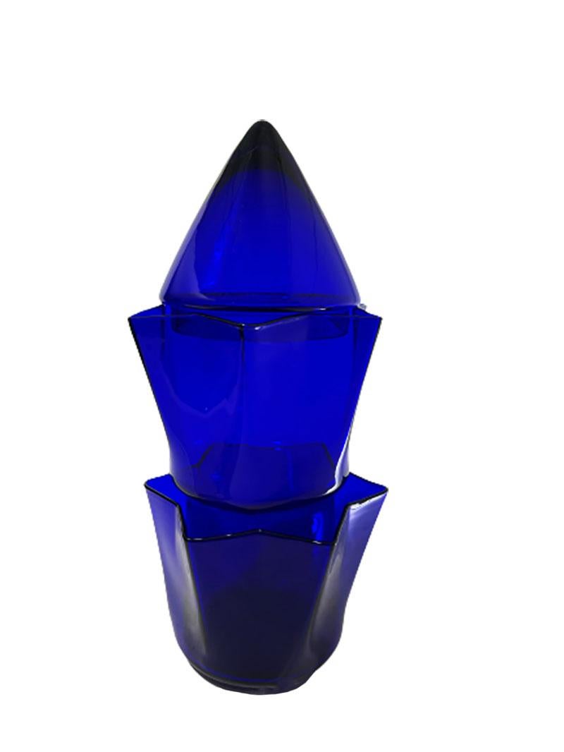A blue glass tulip vase by Willem Noyons, 1997

A 3 piece tulip vase in blue glass, signed and dated by Noyons, 1997. 
A tulip vase that is stacked in and on top of each other
The height is 43 cm in total and wide and the depth 20 cm. 
The