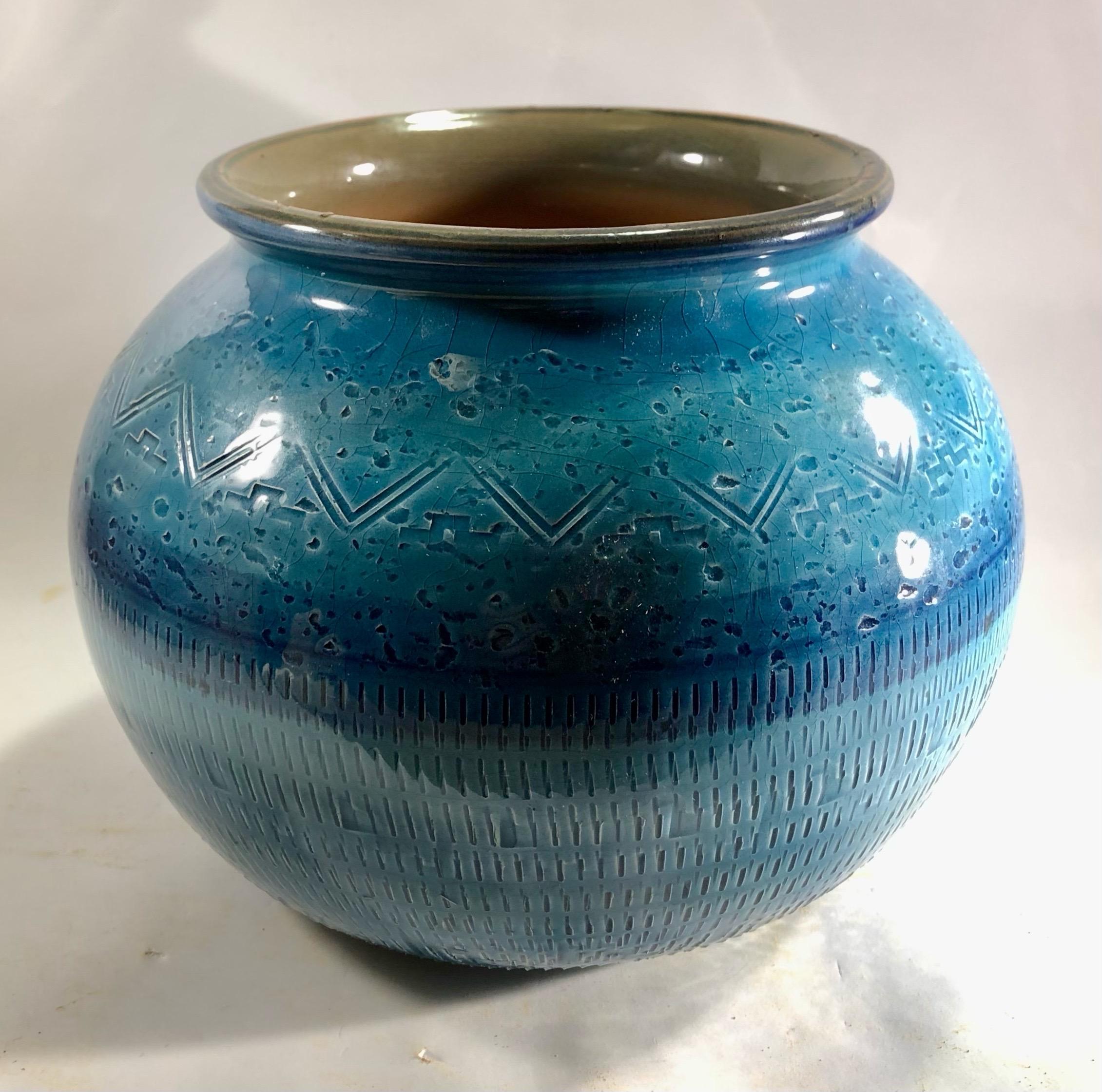 'Rimini blu' glazed ceramic vase designed by Aldo Londi for by Bitossi. Italy, 1960s. This eye-catching vase is made of blue glazed ceramic with engraved patterns surrounding the central part. Its gorgeous shades of blue and the geometric design of